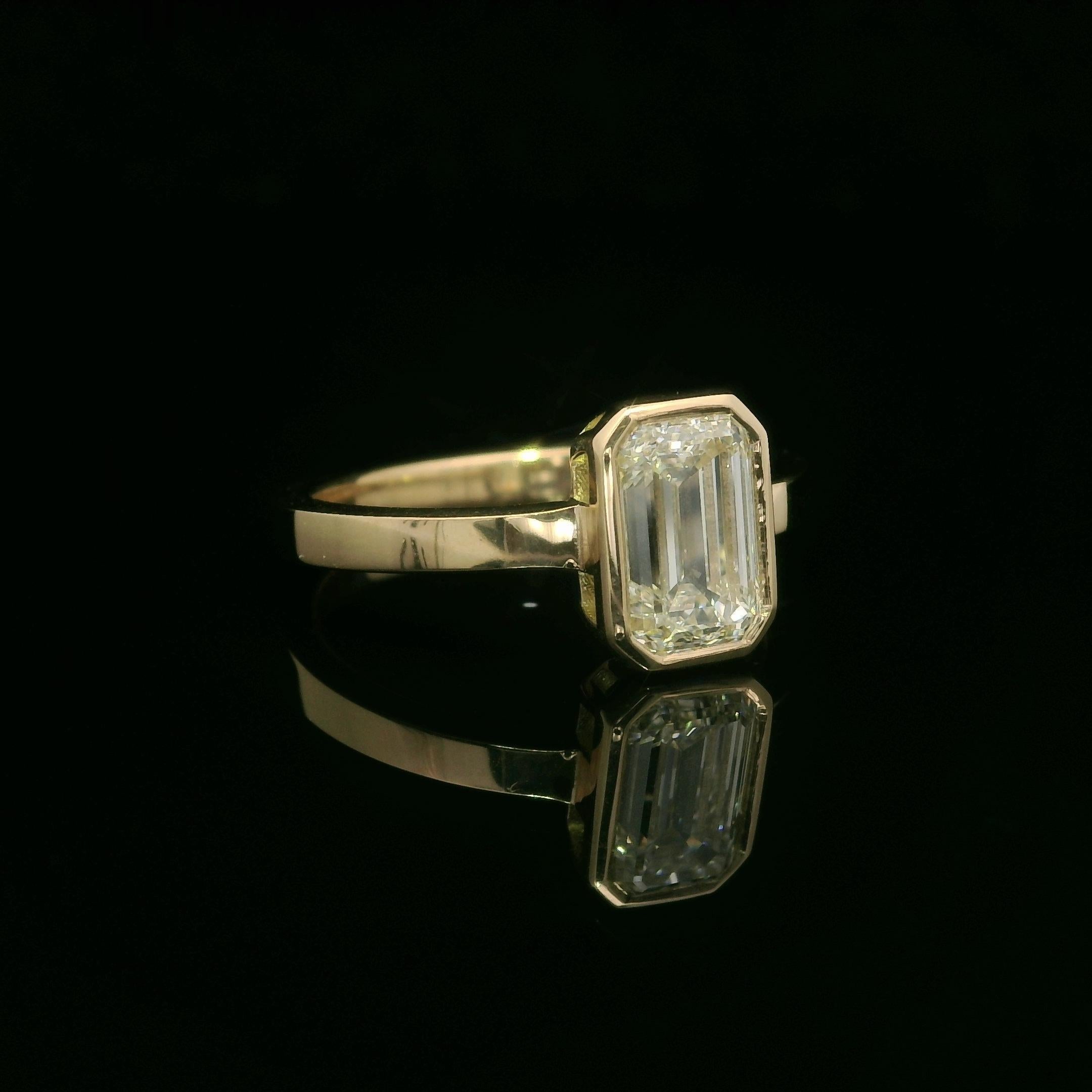 --Stone(s):--
(1) Natural Genuine Diamond - Elongated Emerald Cut - Bezel Set - K Color - VS1 Clarity - 1.50ct (exact - certified) - 1.55ct Ratio
** See Certification Details Below for Complete Info **

Material: Solid 18k Yellow Gold
Weight: 3.73