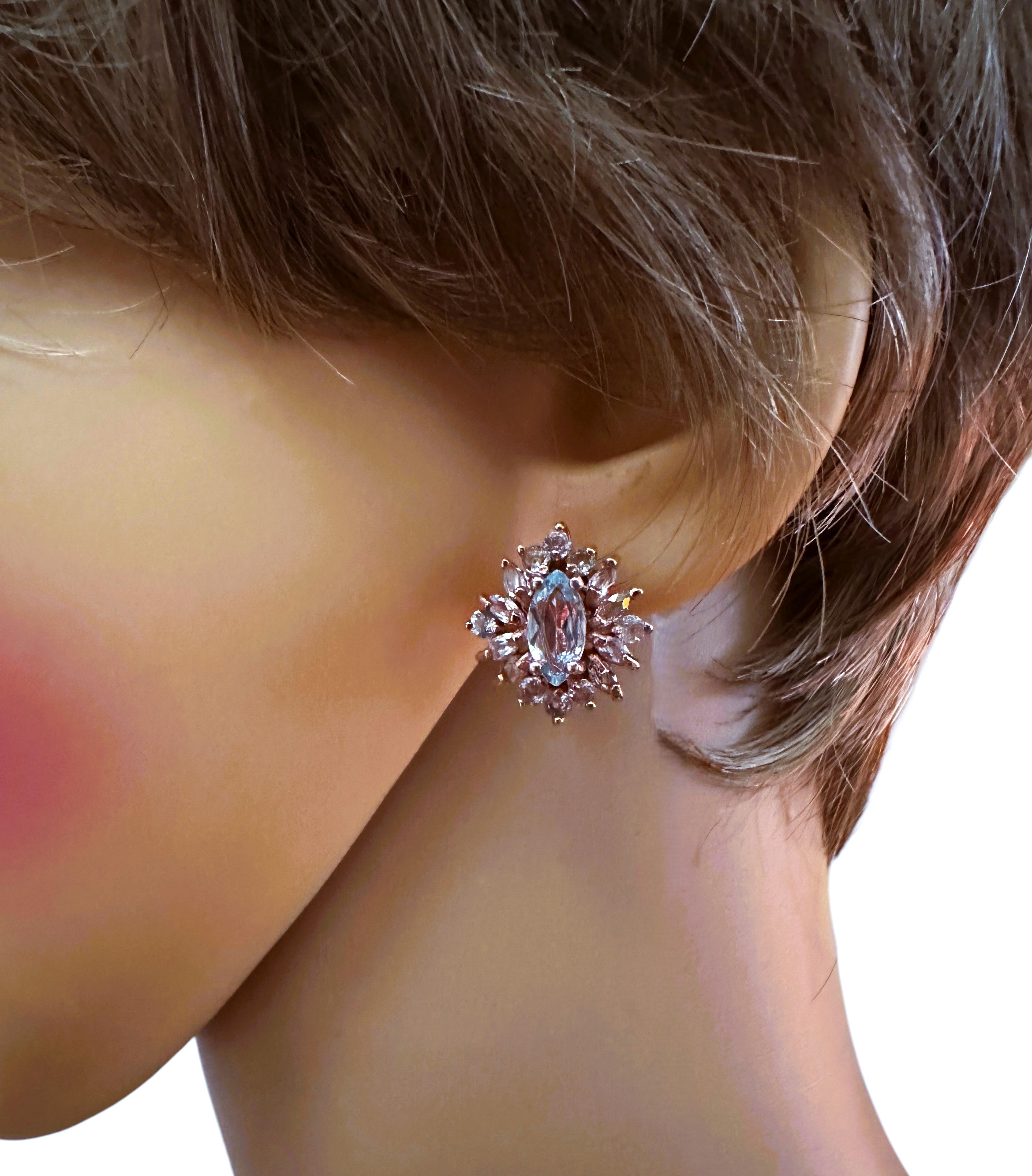 What beautiful colors in these earrings!  They are just dazzling. The main stone is marquise cut and each stone is .95 cts and totals 1.90 cts.  The center stones measure 10 x 5 mm and they are surrounded by marquise and round cut blue sapphire