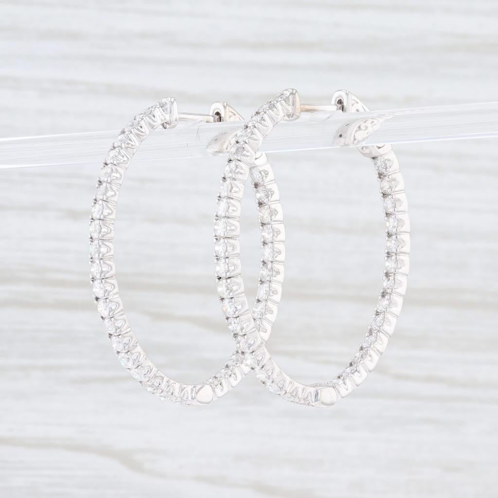These beautiful new hoops have oval shapes with inside out diamond encrusted designs. The brilliant cut diamonds give off a lovely sparkle in their ported bead settings. The earrings have a hinged design with a snap bar closure.

Natural Diamonds -