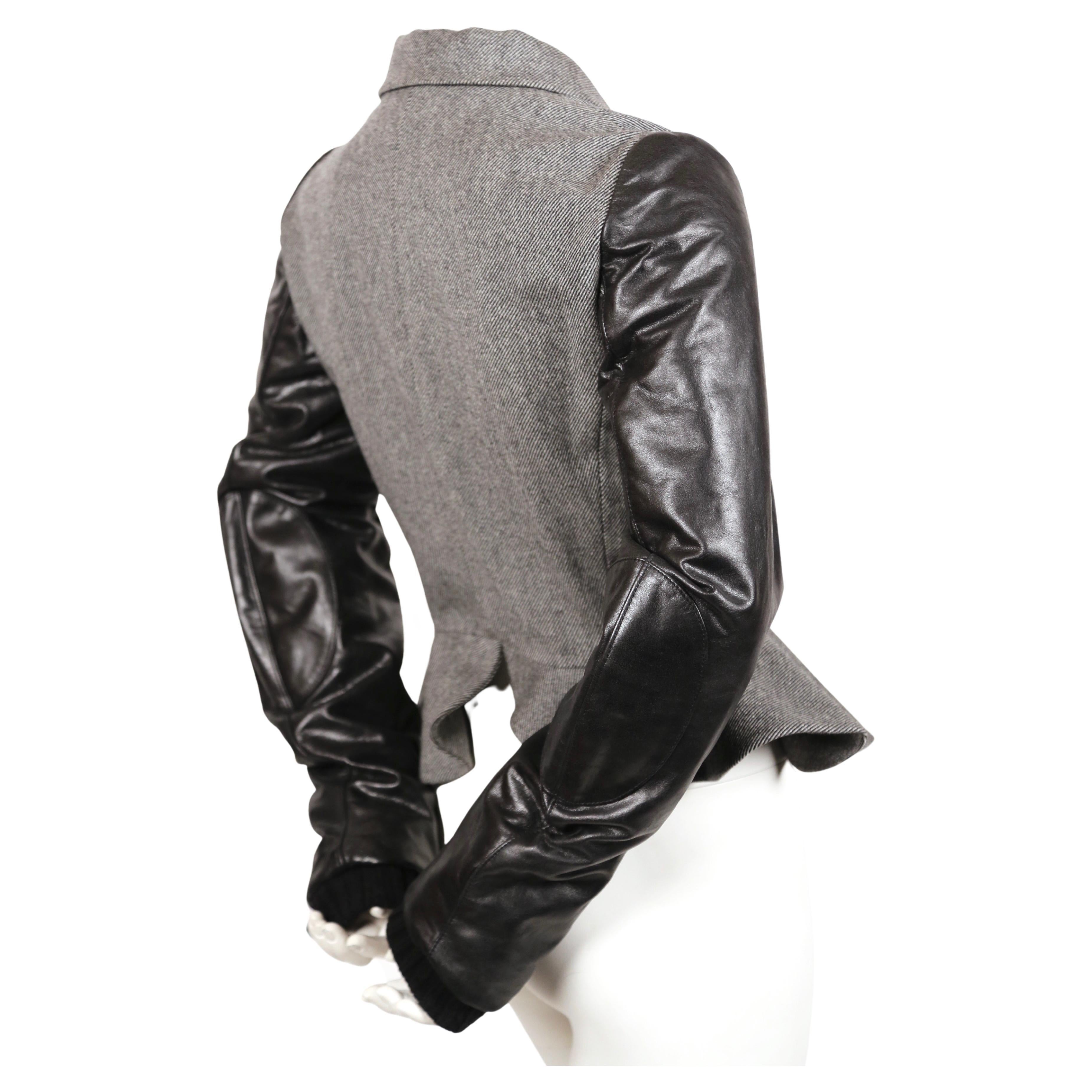 Very rare grey wool jacket with black leather sleeves designed by Nicolas Ghesquiere for Balenciaga exactly as seen on the runway for Fall 2002. French size 40, although this best fits a French size 38 or US 4-6. French 38 is also available for