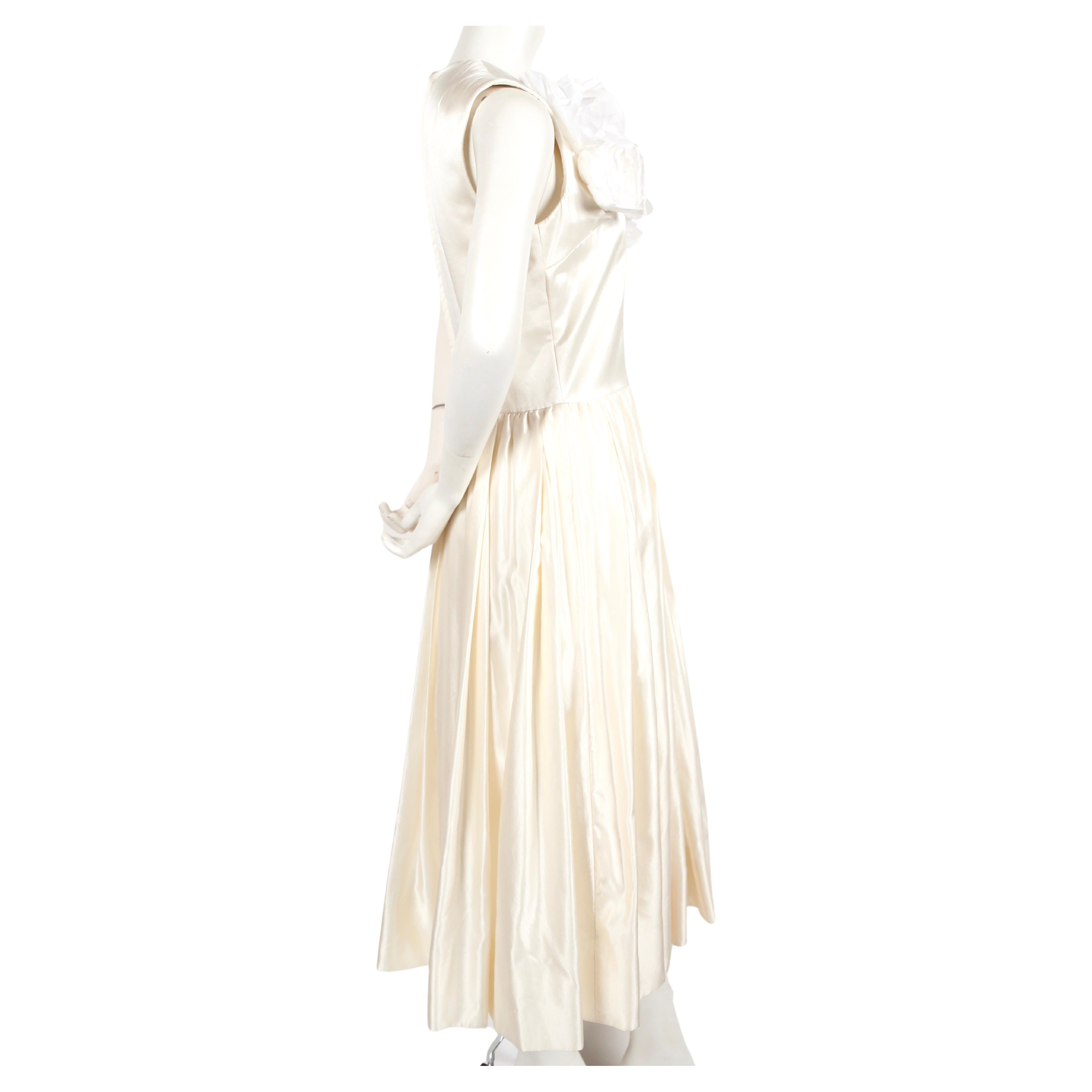 Cream silk, dress with floral detail designed by Rei Kawakubo for Comme Des Garcons dating to the 2012 Spring/Summer collection. Size 'M'. Would be spectacular as a wedding dress. Approximate measurements: shoulder 14