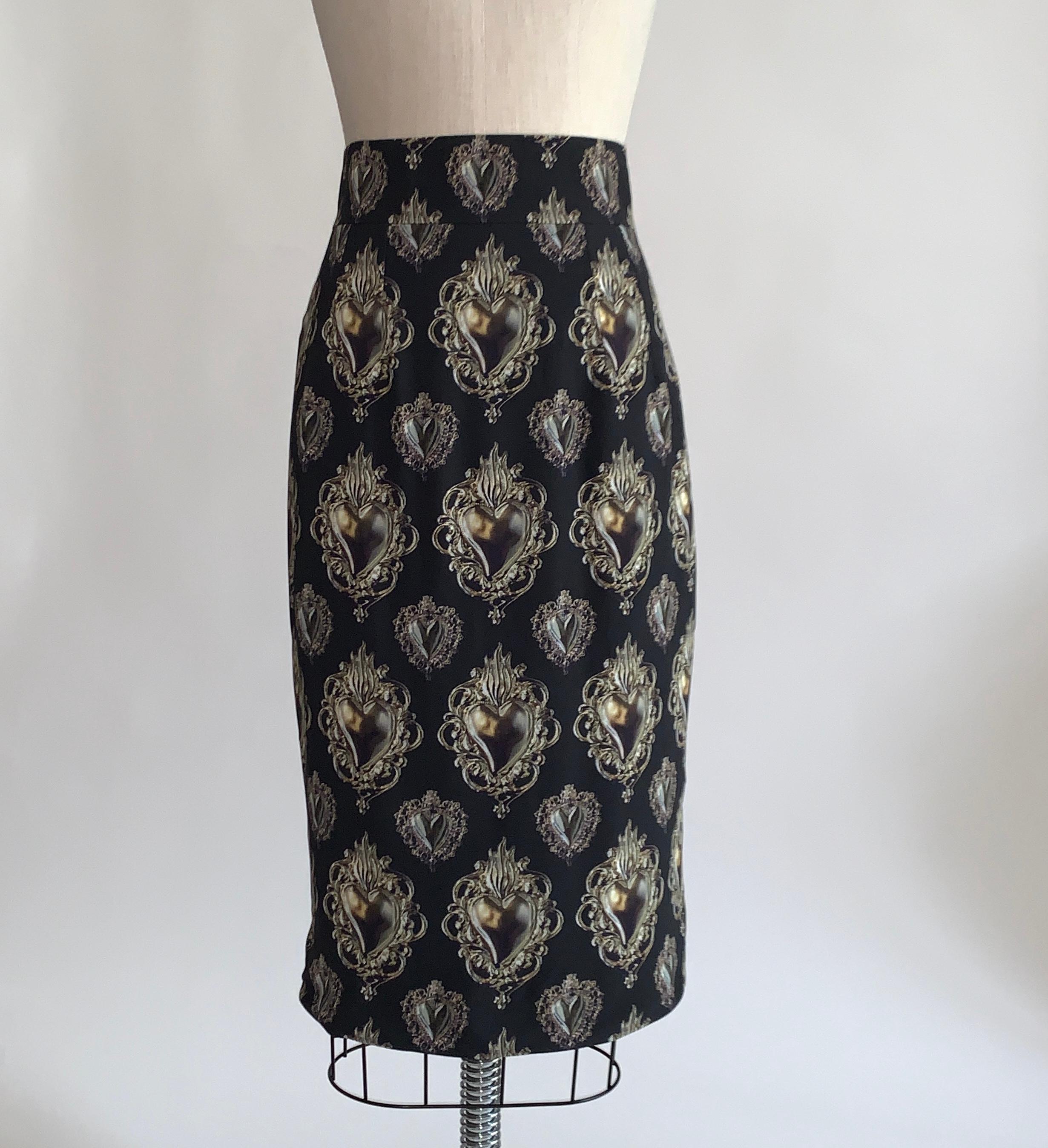 Dolce and Gabbana black and gold sacred heart print straight pencil skirt from the Spring 2015 collection. Slit at back. Back zip and snap closure. This print was seen all over the runway in this collection's show! 

100% rayon/viscose.
Fully lined