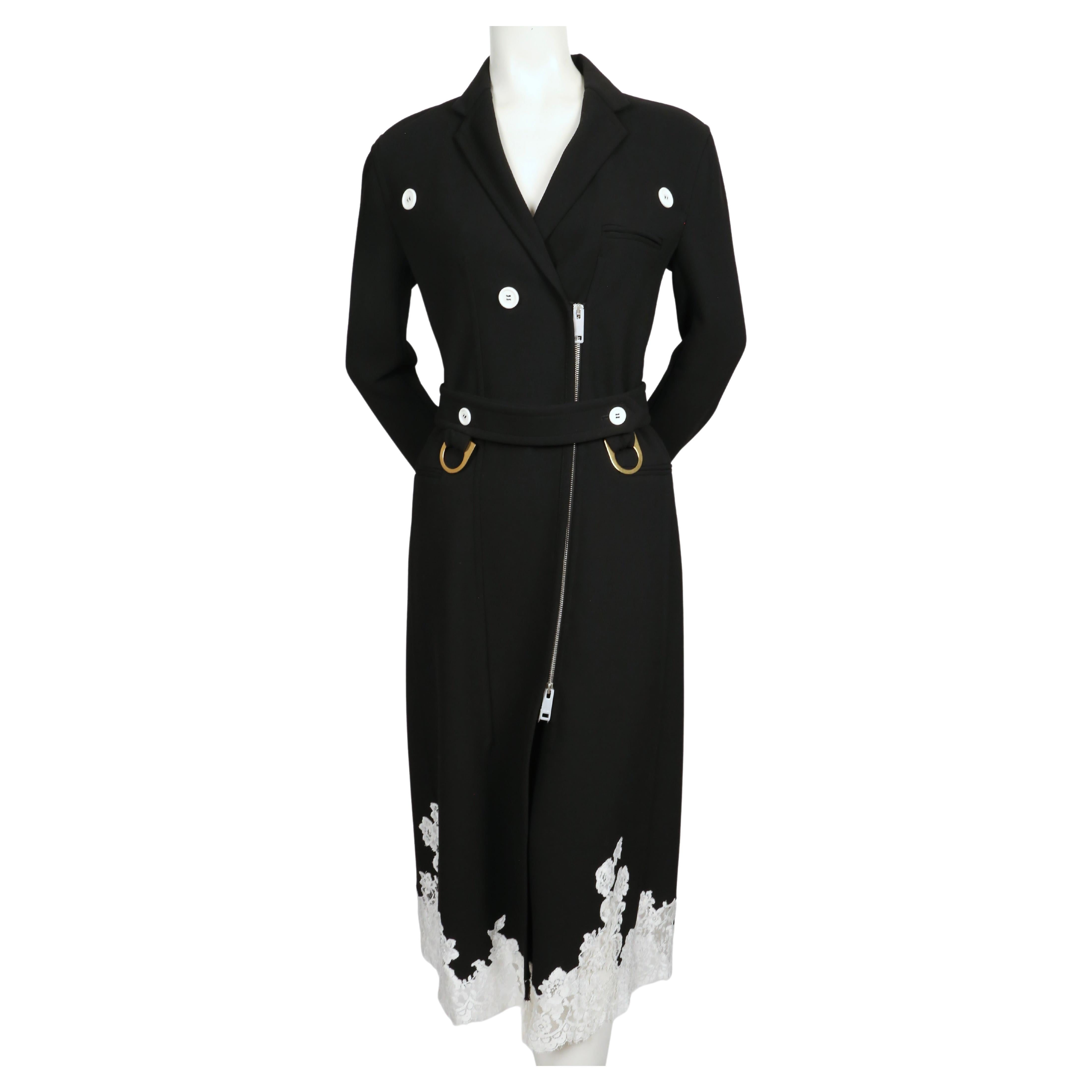 Black stretch wool trench with white lace trim designed by Phoebe Philo for Celine exactly as seen on the spring 2016 runway. French size 40. Coat was not clipped on size 2 mannequin. Approximate measurements: shoulder 17
