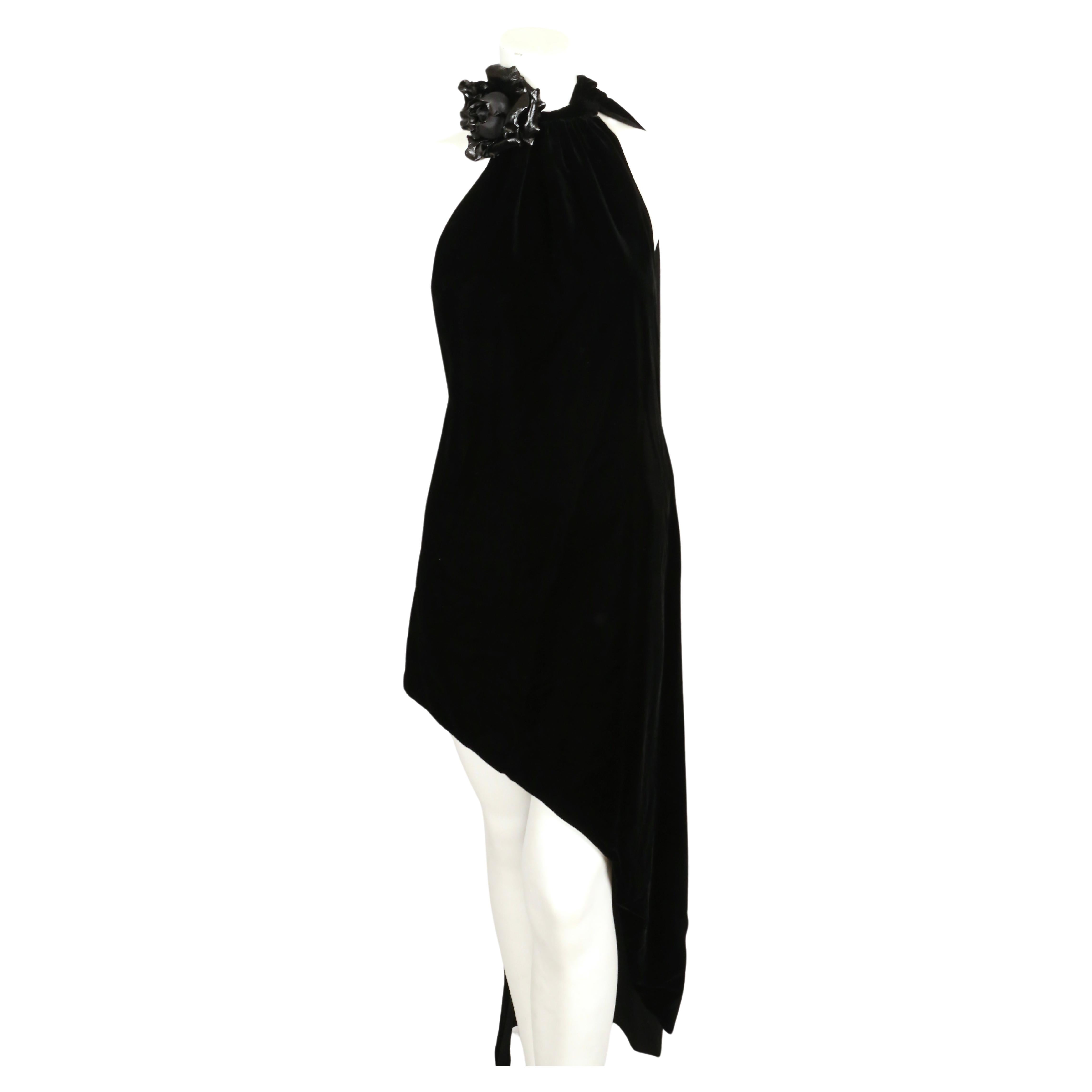 Dramatic, jet black velvet dress with long attached scarf and rose brooch detail designed by Anthony Vaccarello for Saint Laurent exactly as seen on the 2017 fall runway. Dress can be worn with attached scarf worn in the front or the back. Dress is