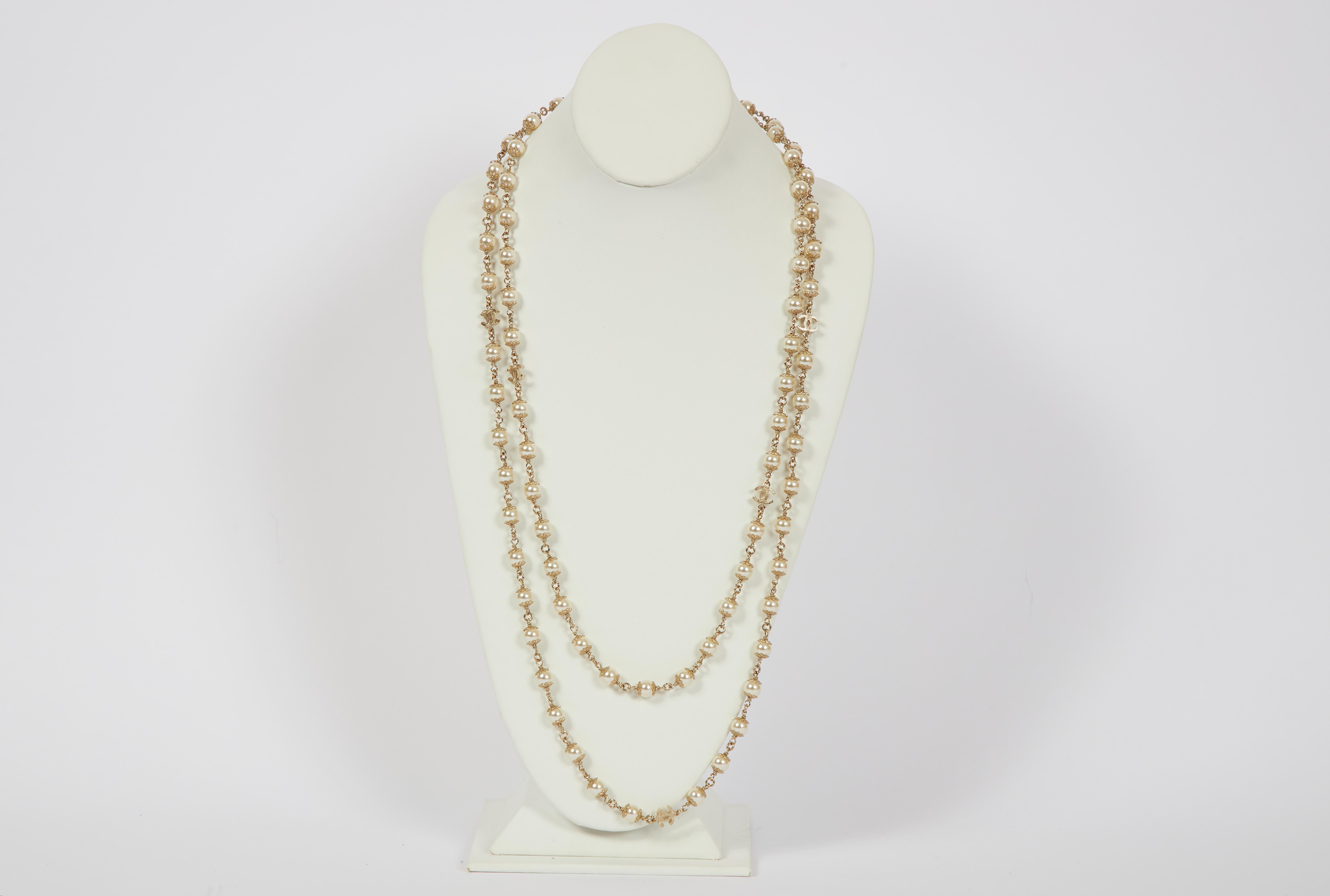 Chanel extra-long faux-pearl sautoir necklace. Can be worn single, double, or triple. Spring 2019 collection. Original suede pouch and box included.