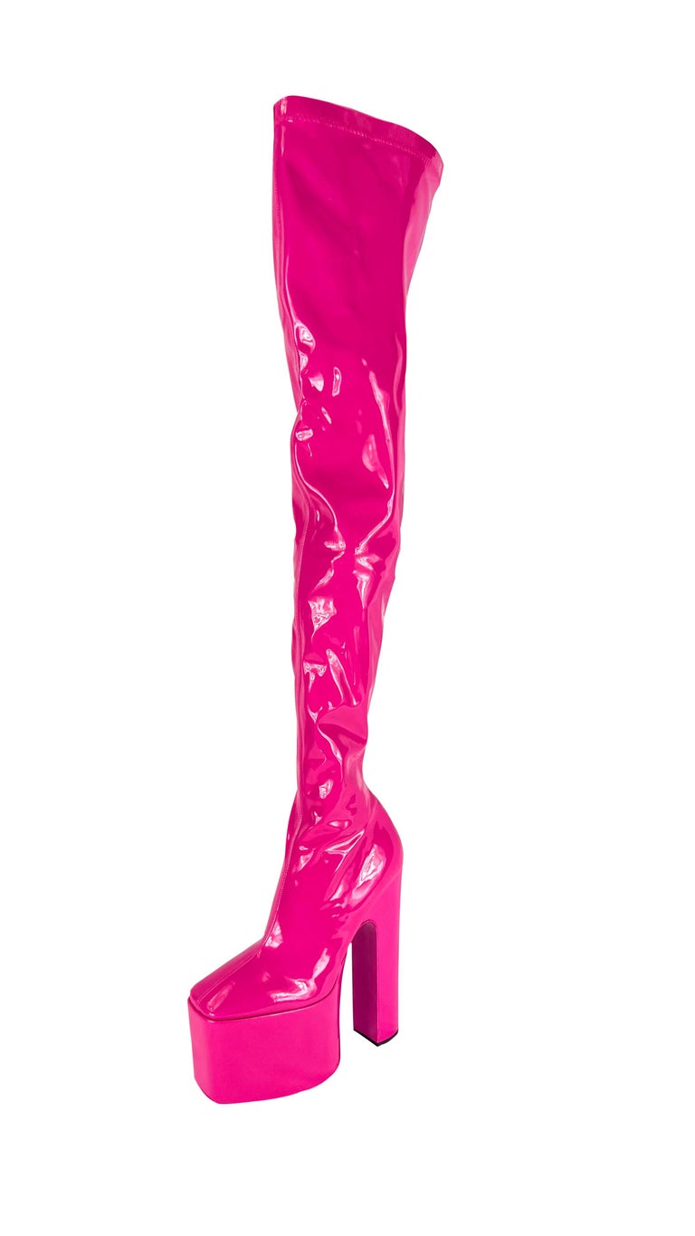 TheRealList presents: a pair of insane hot hot pink Valentino latex platform boots, designed by Pierpaolo Piccioli. From the Fall/Winter 2022 collection, many similar platform heels debuted on the season's runway. These spectacular never used