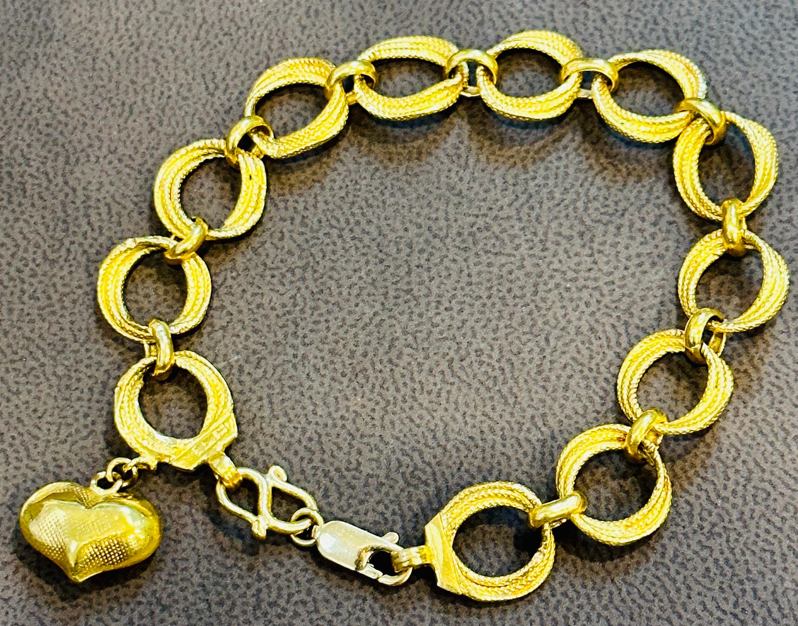 Solid 23 karat gold
 23 Karat Yellow Gold 15.75  Gm  link Bracelet , 7  Inches
23 Karat Yellow  Gold Bracelet made of authentic solid gold.  It is  nicely polished and stamped 
stamped 96.57
In addition to its original s shape hook , it has an