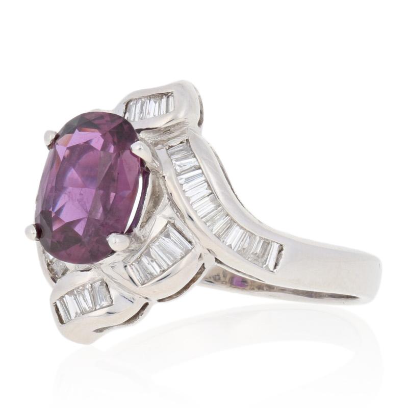 Treat yourself to the sweet luxury of gemstone jewelry! Featuring a graceful halo design, this NEW 18k white gold bypass ring showcases a breathtaking GIA-graded ruby solitaire accompanied by shimmering diamond baguettes.

This ring is a size 6 1/2,
