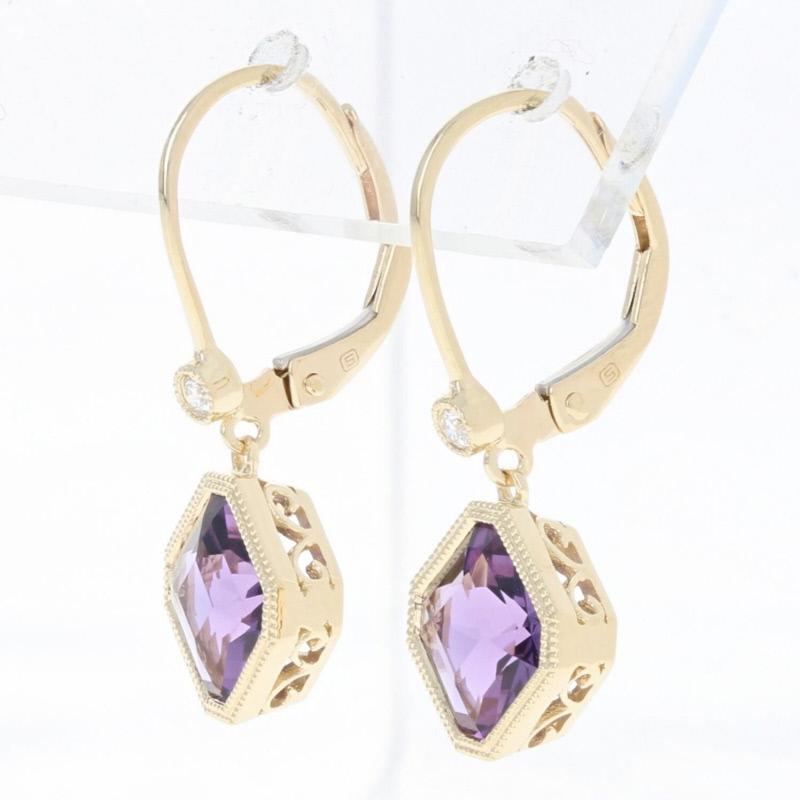 Metal Content: Guaranteed 14k Gold as stamped

Stone Information: 
Genuine Amethysts
Color: Purple  
Carats: 2.54ctw 

Natural Diamonds  
Clarity: VS2 
Color: G  
Cut: Round Brilliant 
Carats: 0.04ctw

Total Carats: 2.58ctw 

Style: Dangle
Fastening