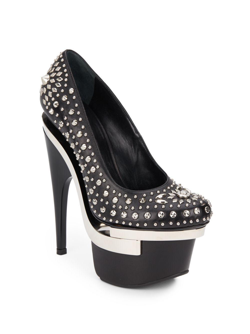 New Versace Triple Platform Leather Shoes Pumps
Designer size - 38 B ( US 8 B )
Colors - Silver & Black
100% Leather, Silver Tone Metal Studs, Leather Lining, Leather Sole
Heel Height Approx. - 6.5 inches, Platform - 2.5 inches.
Made in Italy
New