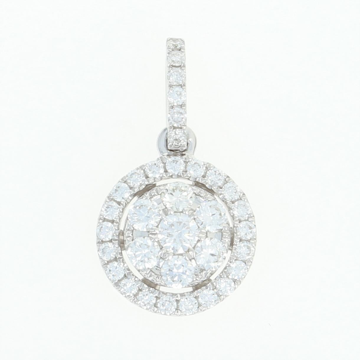 Sparkling like a star-lit sky, this luminous piece will light up any special occasion! Fashioned in 14k white gold, this NEW pendant showcases a glittering cluster of icy white diamonds encircled by a diamond halo and accompanied by shimmering