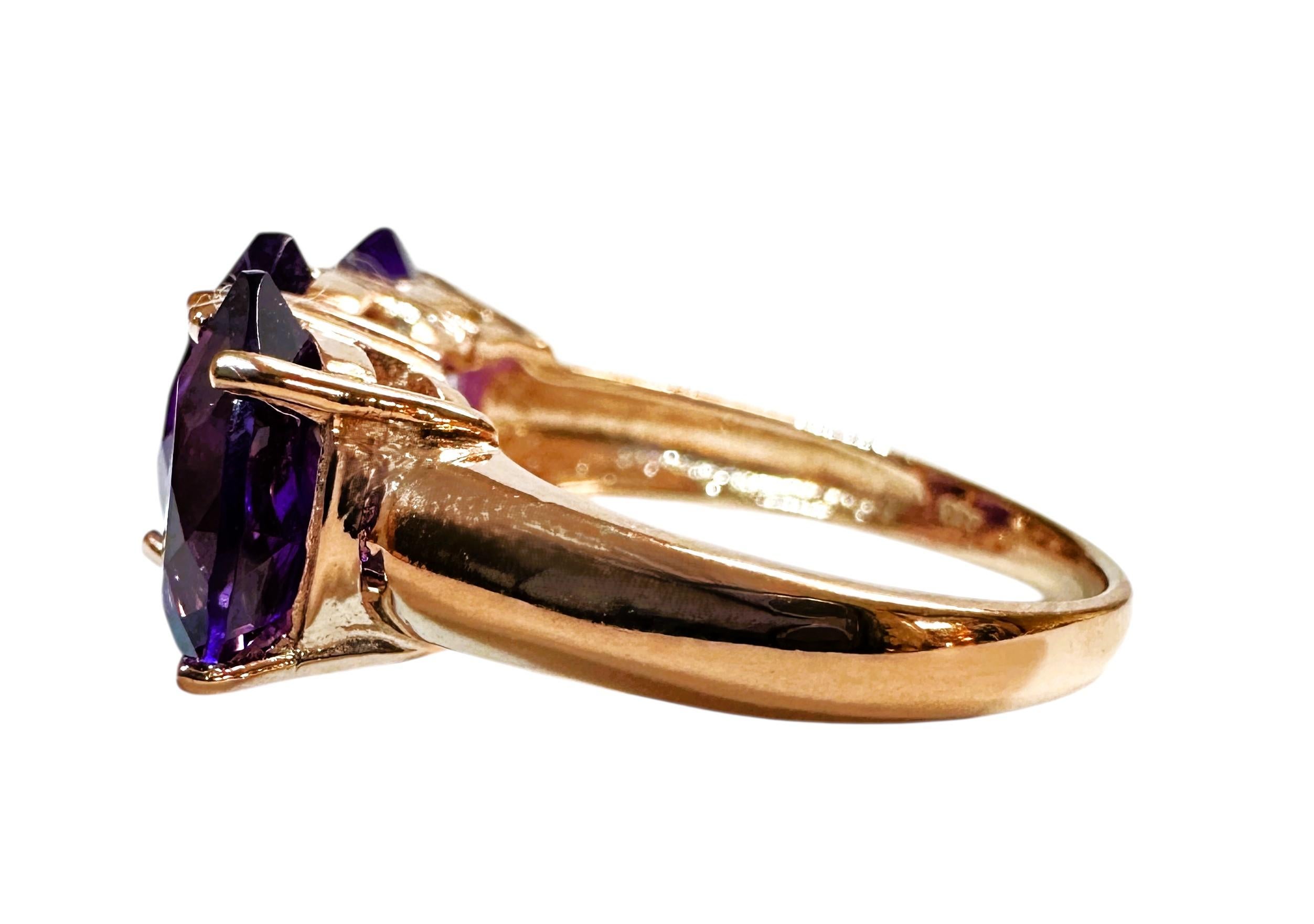 This ring is just gorgeous.  The ring is a size 6.  The Amethyst stones are from Brazil and are just exquisite. The stones are a fancy pear cut stones and measure 9.2 x 7 mm and total 4.60 carats.  The weight in Grams is 3.63   The ring is sizable