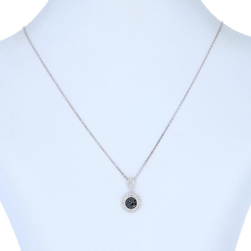 Country of Origin: India
Metal Content: Guaranteed Sterling Silver as stamped

Stone Information:
Natural Diamonds 
Treatment: Color Enhanced (black)  
Clarity: I1 
Color: G - H; Black   
Cut: Round  
Total Carats: 0.33ctw 

Pendant: 13/16