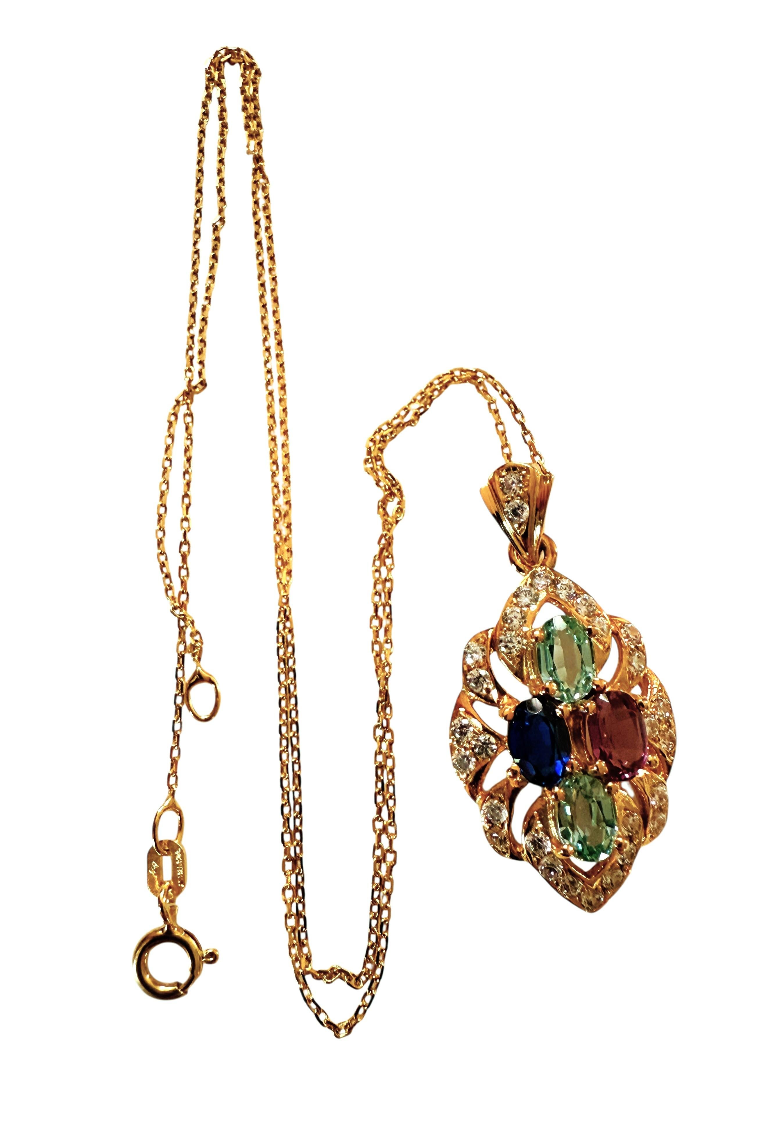 This pendant is gorgeous!  The stones are from Africa.  There are 4 oval cut sapphires measuring 6 x 4 mm.  There are 2 Paraiba Blue sapphires, a Dark Blue Sapphire and a Purple Sapphire.  The setting has a pierced leaf design and it is encrusted