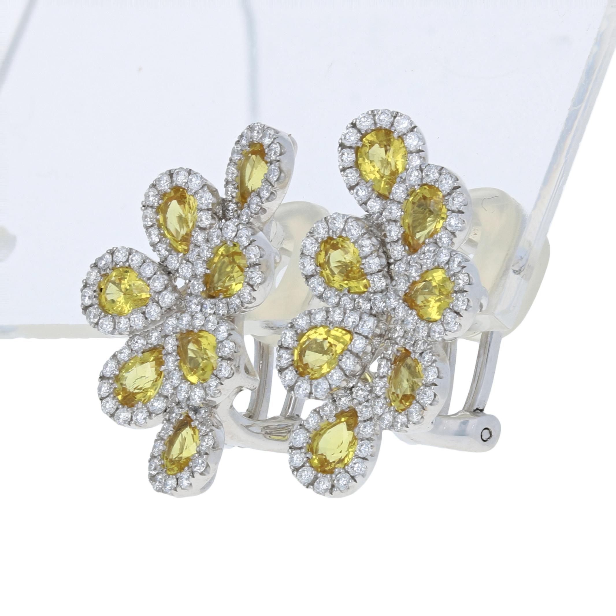 Brand: Spark

Metal Content: Guaranteed 18k Gold as stamped

Stone Information: 
Genuine Sapphires
Treatment: Heating  
Color: Yellow  
Cut: Pear
Carats: 2.80ctw 

Natural Diamonds  
Clarity: VS1 
Color: F  
Cut: Round Brilliant
Carats: 1.01ctw