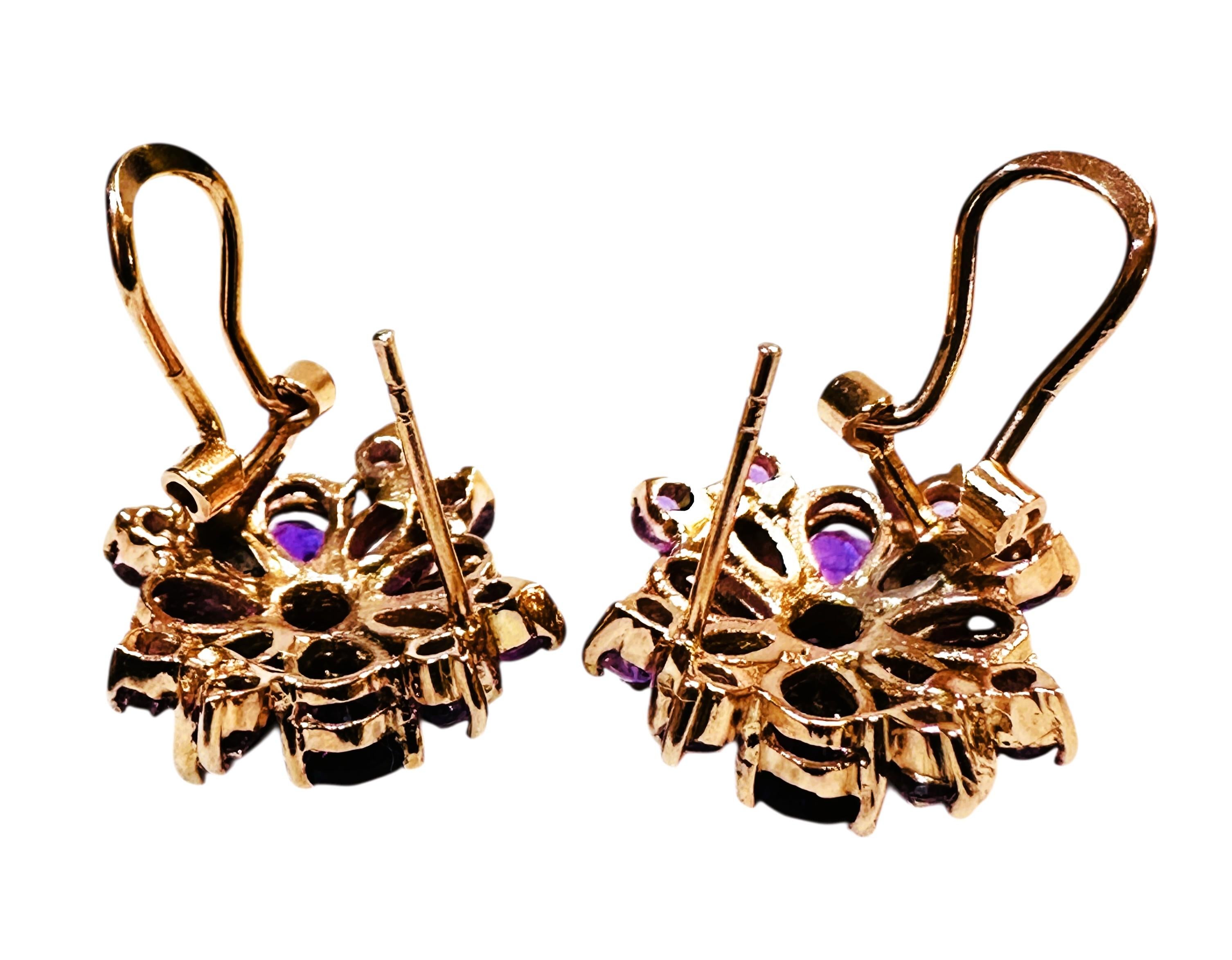 These are very beautiful and rich looking earrings. The stones are from Africa.  They are pear cut stones and there are 6 on each earring totaling 2 carats per earrings.    They measure 4.2 x 3.8 mm. They are very high-quality stones.  There are