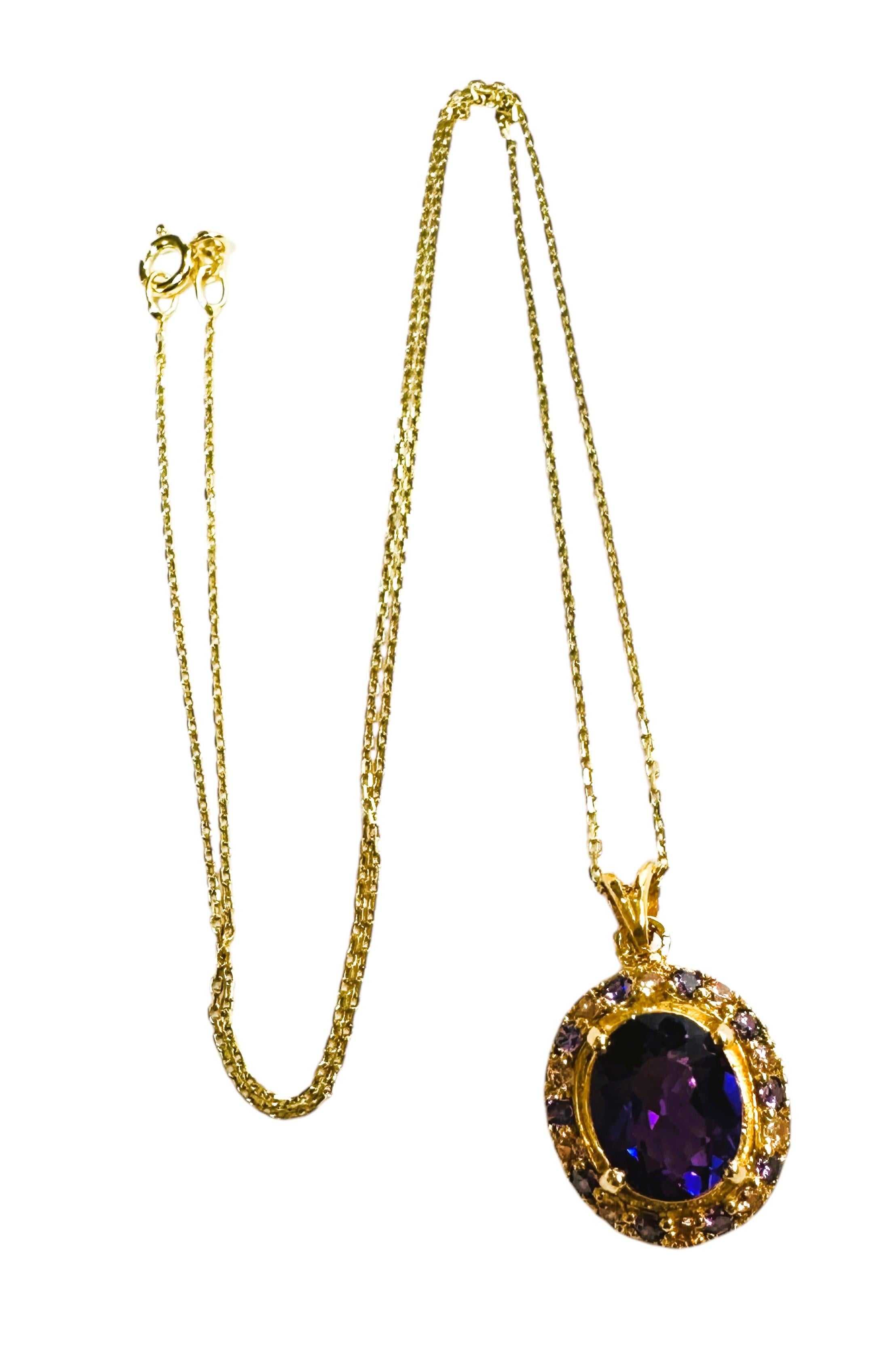 The stone is from Africa and is just exquisite. The stone is a beautiful violet purple and is 4.02 carats.  The stone is an oval cut stone and measures 11 x 9 mm   It is surrounded by diamond cut white and purple sapphires.  The are all placed in a