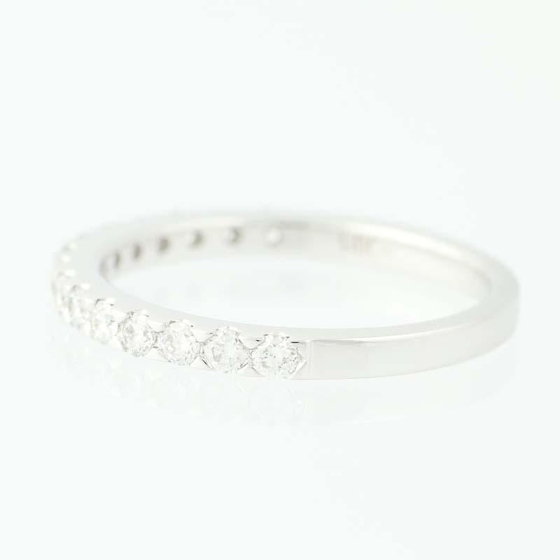 Pledge your love and lifetime devotion with this exquisite wedding band! This NEW piece is fashioned in stylish 14k white gold and features an inset row of sparkling diamonds. Elegant as a wedding band, this beautiful ring would also make a