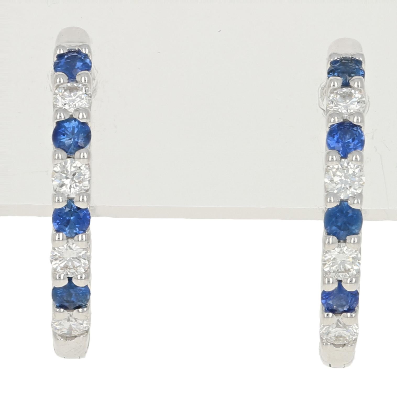 Add a sweet splash of sparkling color to your wardrobe! Fashioned in a chic huggie hoop design, these NEW earrings showcase silky blue sapphires and glittering diamonds set in 14k white gold. 

Metal Content: Guaranteed 14k Gold as stamped

Stone