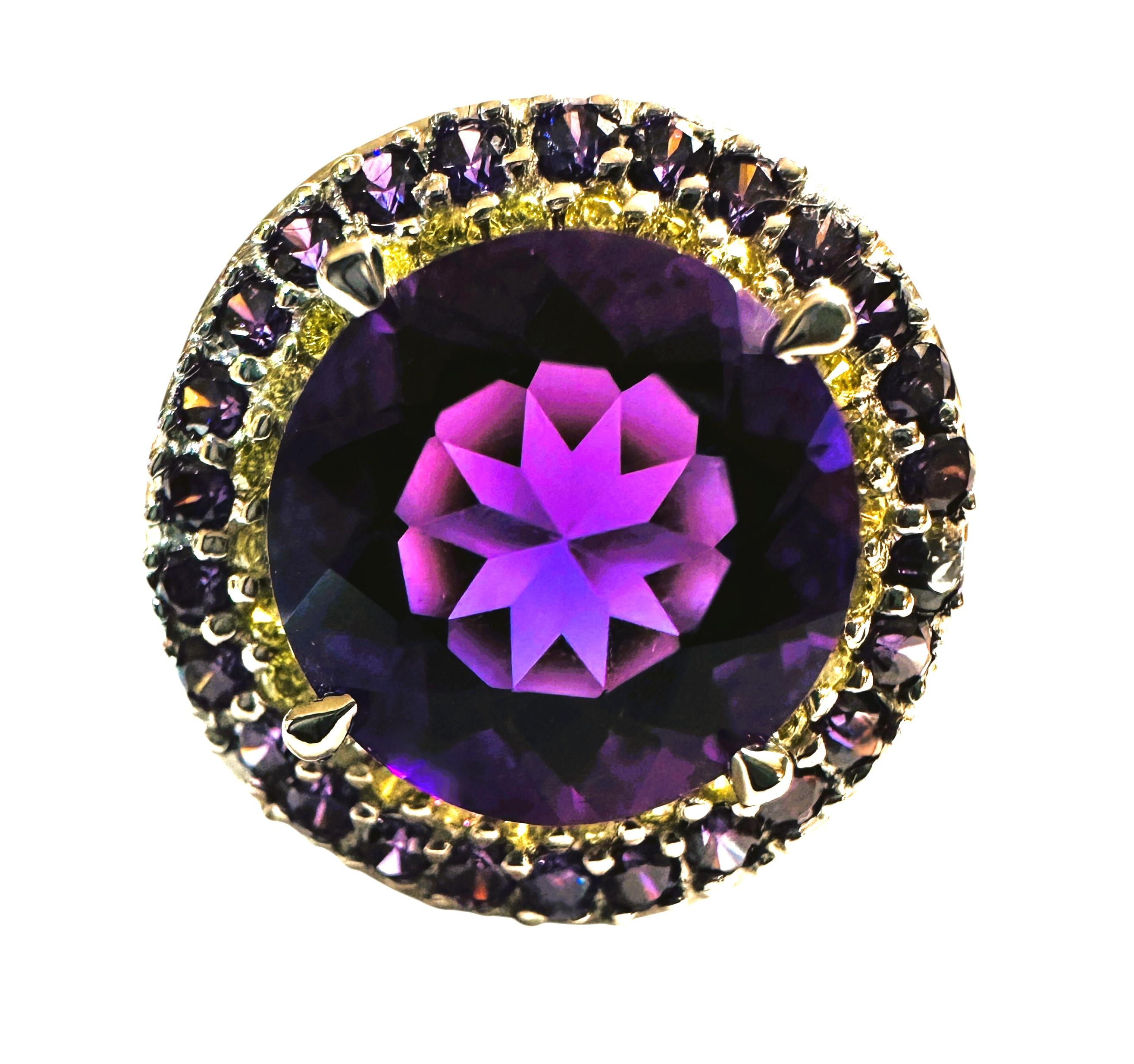 I just love the beautiful colors in this ring.  The ring is a size 6.25 and just stunning.  The main stone is a round cut stone and is 4.75 carats.  It measures 11 x 11 mm and is surrounded by diamond cut yellow sapphires and those are surrounded by
