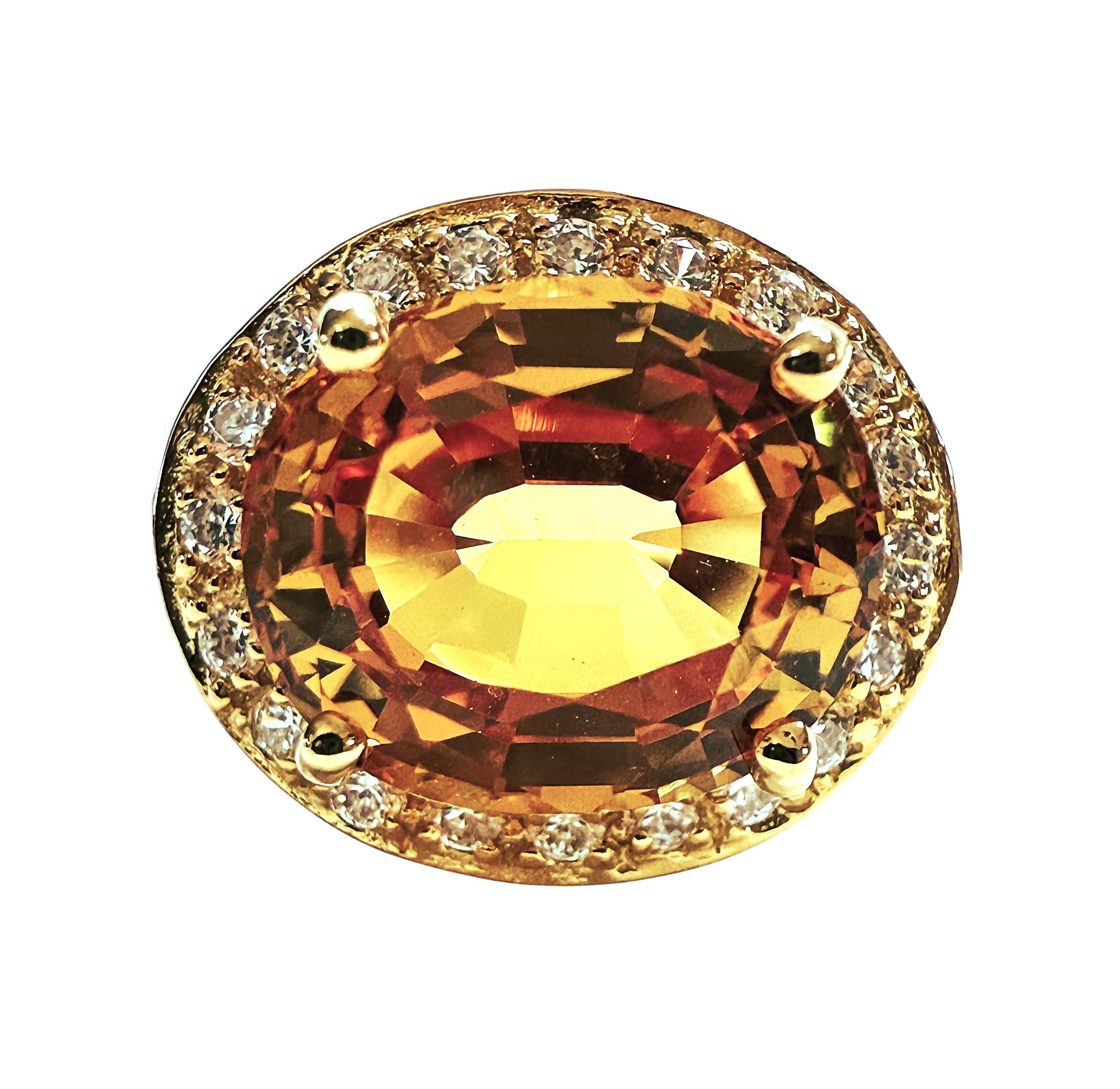 What a gorgeous ring!  The stone is from Sri Lanka and just a beautiful shade of yellow.  The ring is a size 6.75.  It is a fancy oval cut stone and is 4.9 carats.  It measures 10.7 x 9 and is surrounded by diamond cut white sapphire stones. They