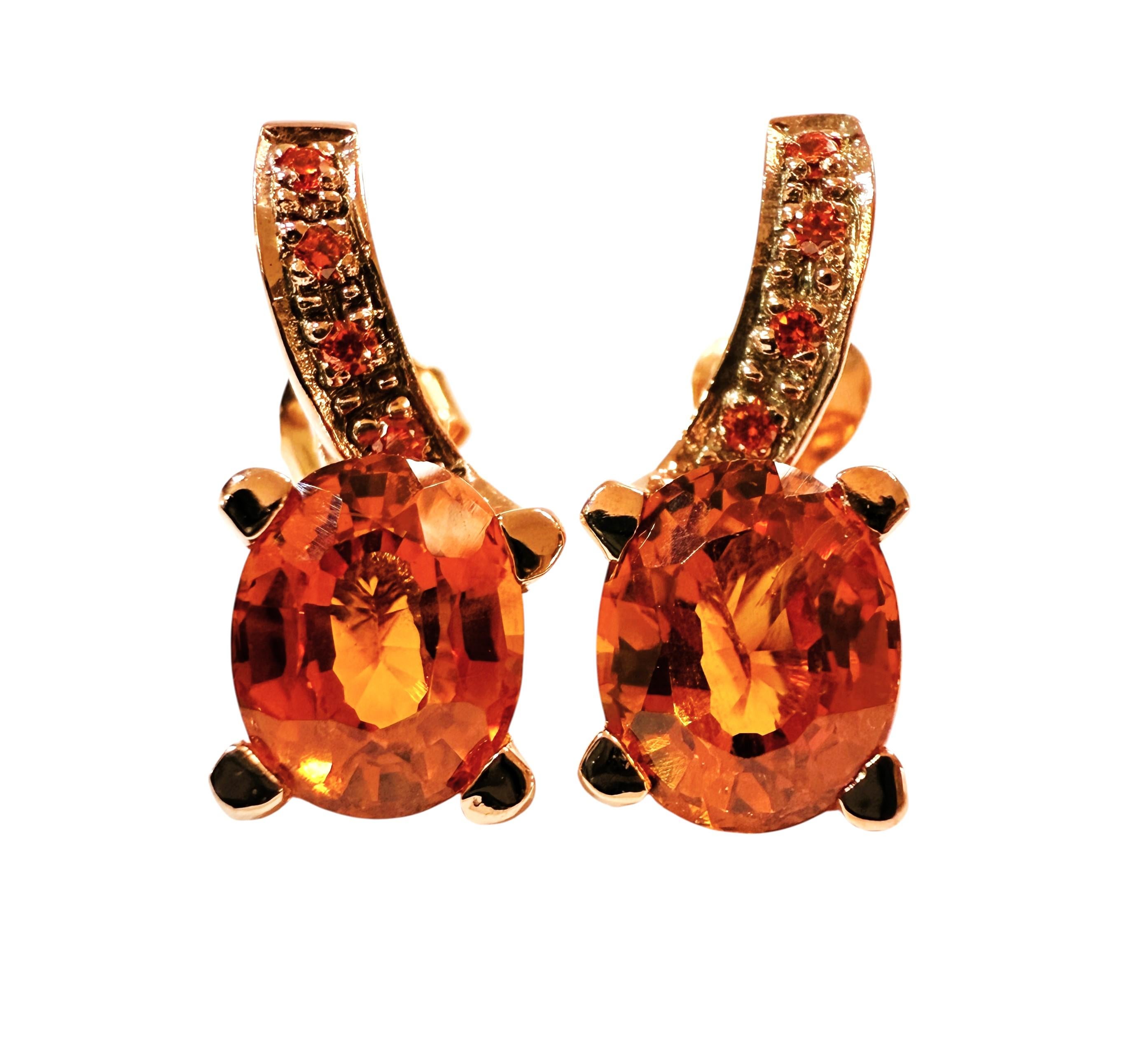 I just love the beautiful colors in these stones.  What a great combination.  There is a beautiful oval cut Sunset Orange Sapphire stone on the earrings, and each one is 2.5 carats.  They measure 9 x 7 mm.  They are from Africa and is just
