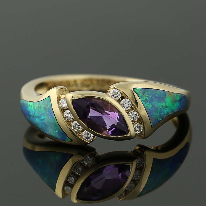 Surprise a special friend or family member with this gorgeous designer ring! Fashioned by Kabana in 14k yellow gold, this chic NEW piece features a diagonally-set amethyst bordered in diamond accents. Inlaid opals adorn the sides of the band as they