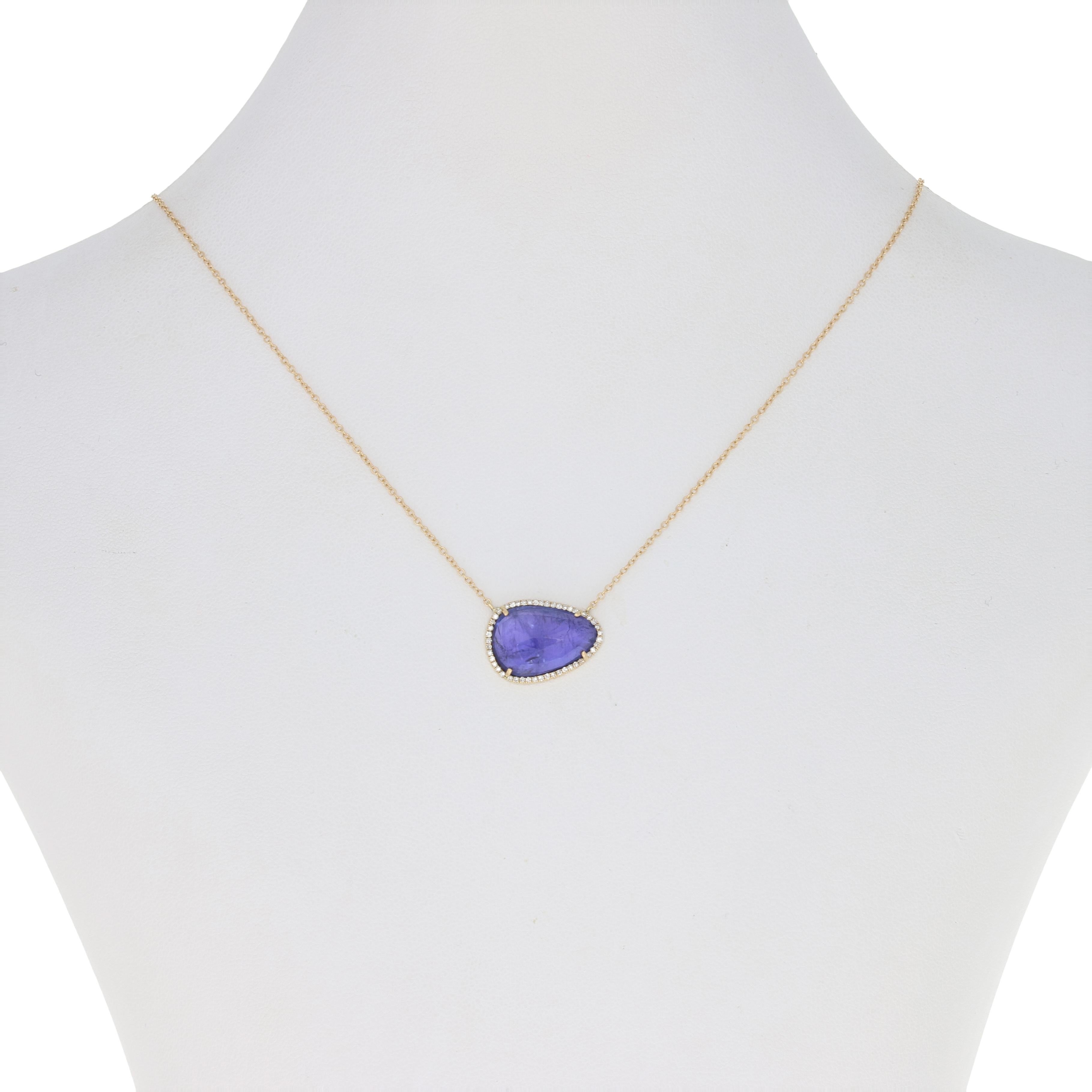 Invigorate your wardrobe with a bright splash of color! Created in 14k yellow gold, this NEW cable chain necklace is adorned with an attached tanzanite pendant framed by sparkling white diamonds. 

Metal Content: Guaranteed 14k Gold as