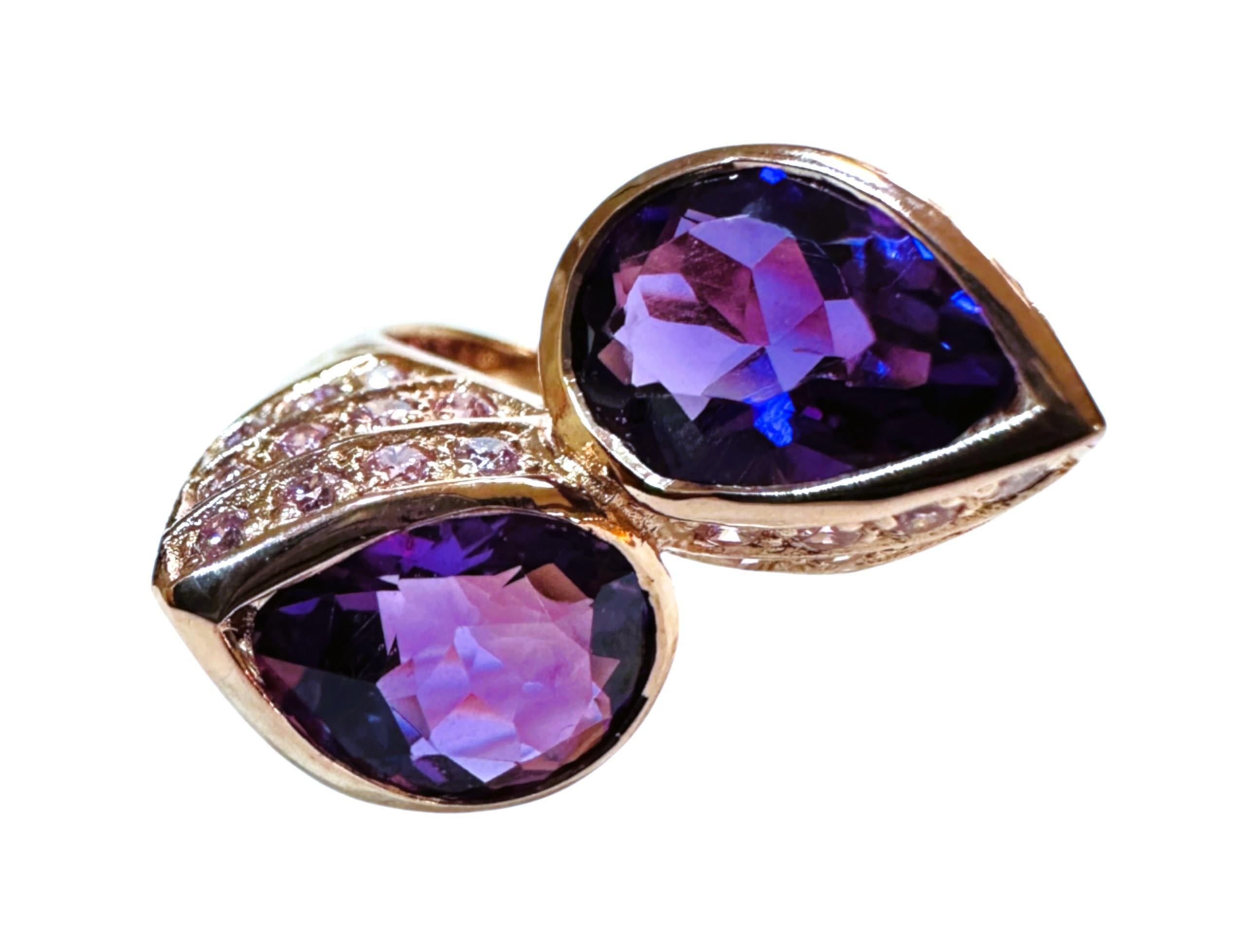 The ring is just stunning!  It is a size 6.5. The two Amethyst stones are from Brazil.  They are beautiful pear cut stones and each are 2.95 cts and total 5.9 cts.  They are very high quality stones. They measure 9 x 11 mm and they are surrounded by