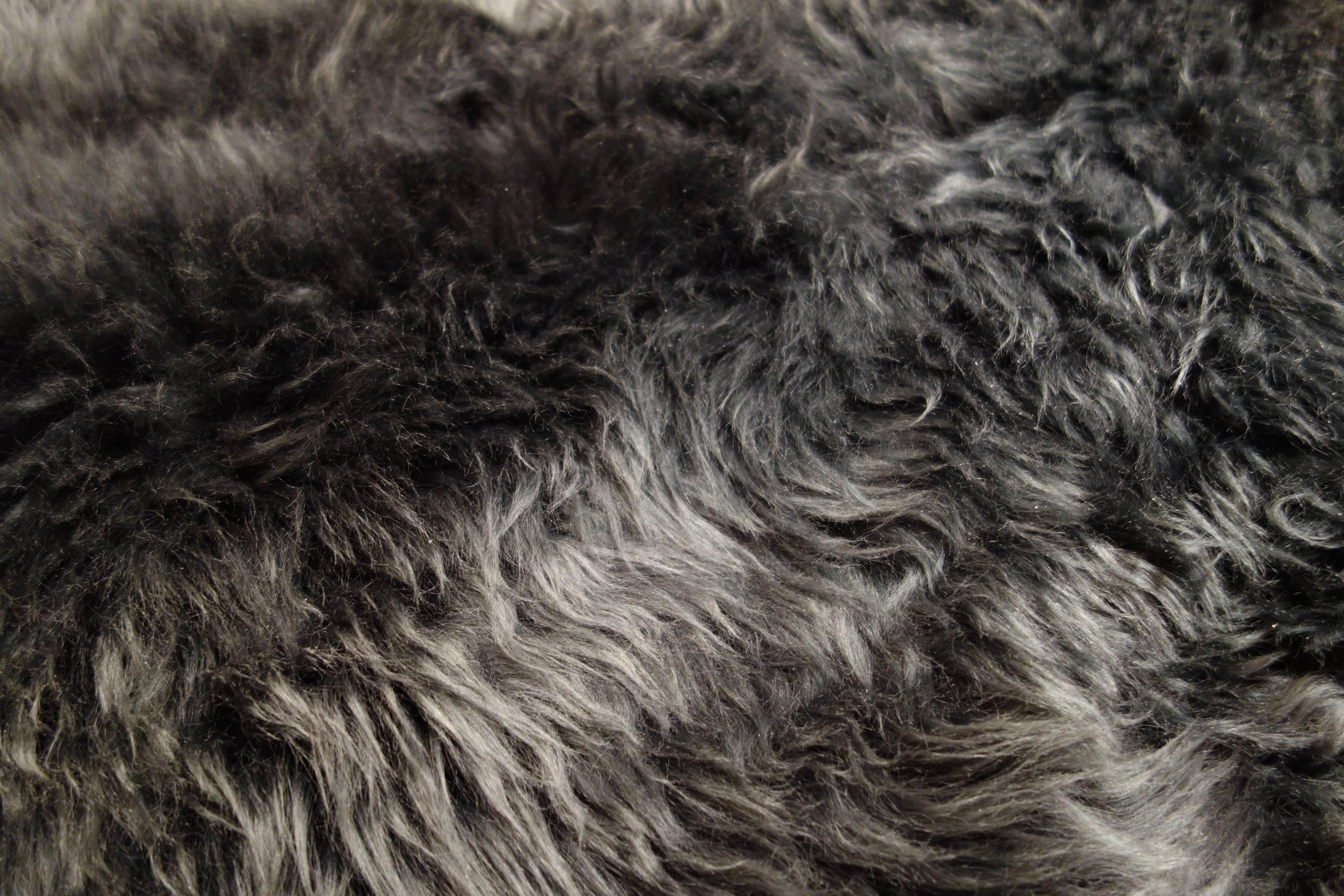 A new 6 ft. sumptuous charcoal gray sheepskin rug. Sold individually: five available.