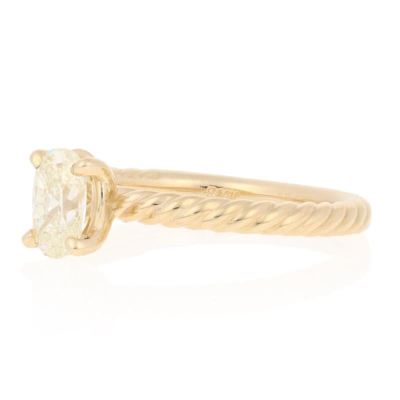Watch your sweetheart’s eyes sparkle when you present her with this radiant treasure! Accented by the band’s textured rope design, this elegant NEW engagement ring showcases a GIA-graded diamond solitaire set in classic 14k yellow gold.

This ring