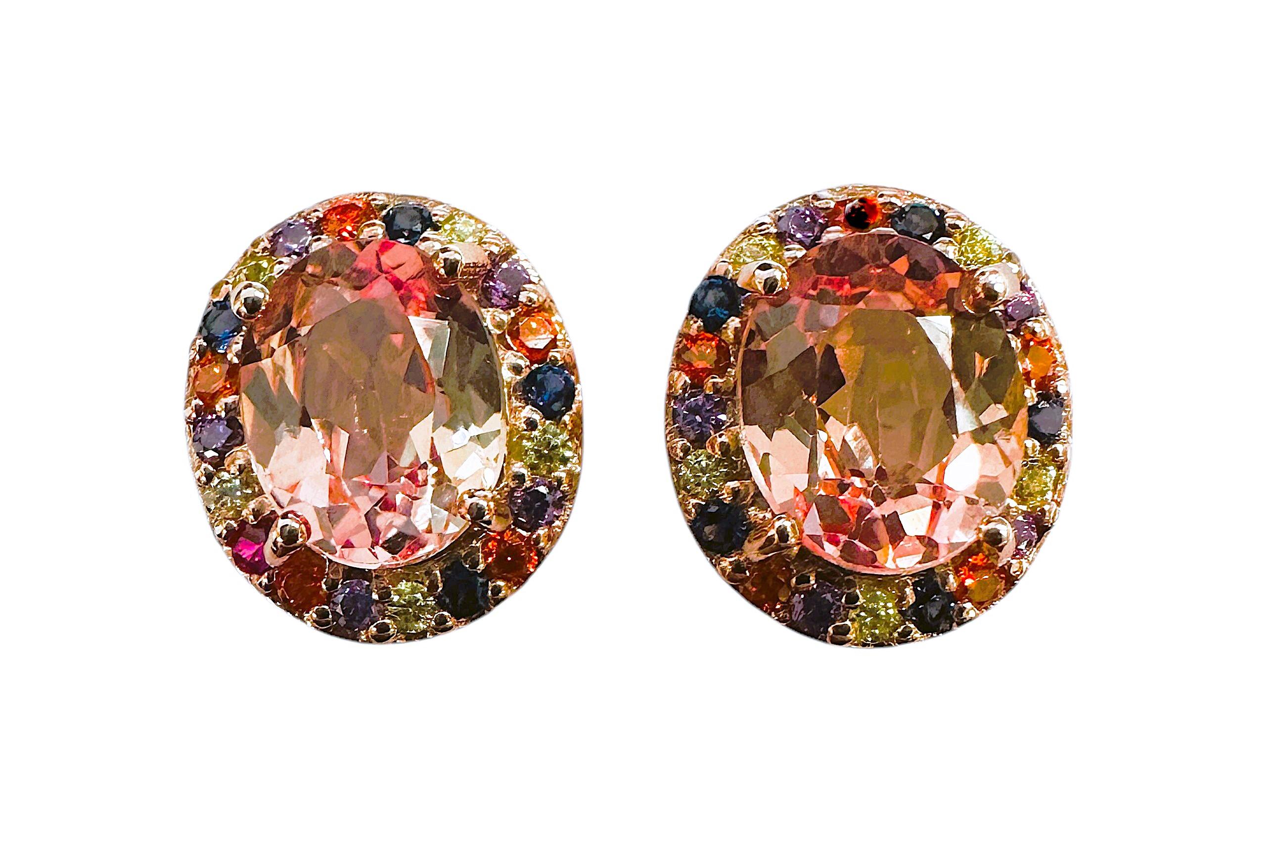 These earrings are just stunning!  What great color combinations they have.  The main stones are oval cut stones  and each one is 3.15 carats.  They measure 9.3 x 7.3 mm and surrounded by a variety of colored diamond cut sapphires which really makes
