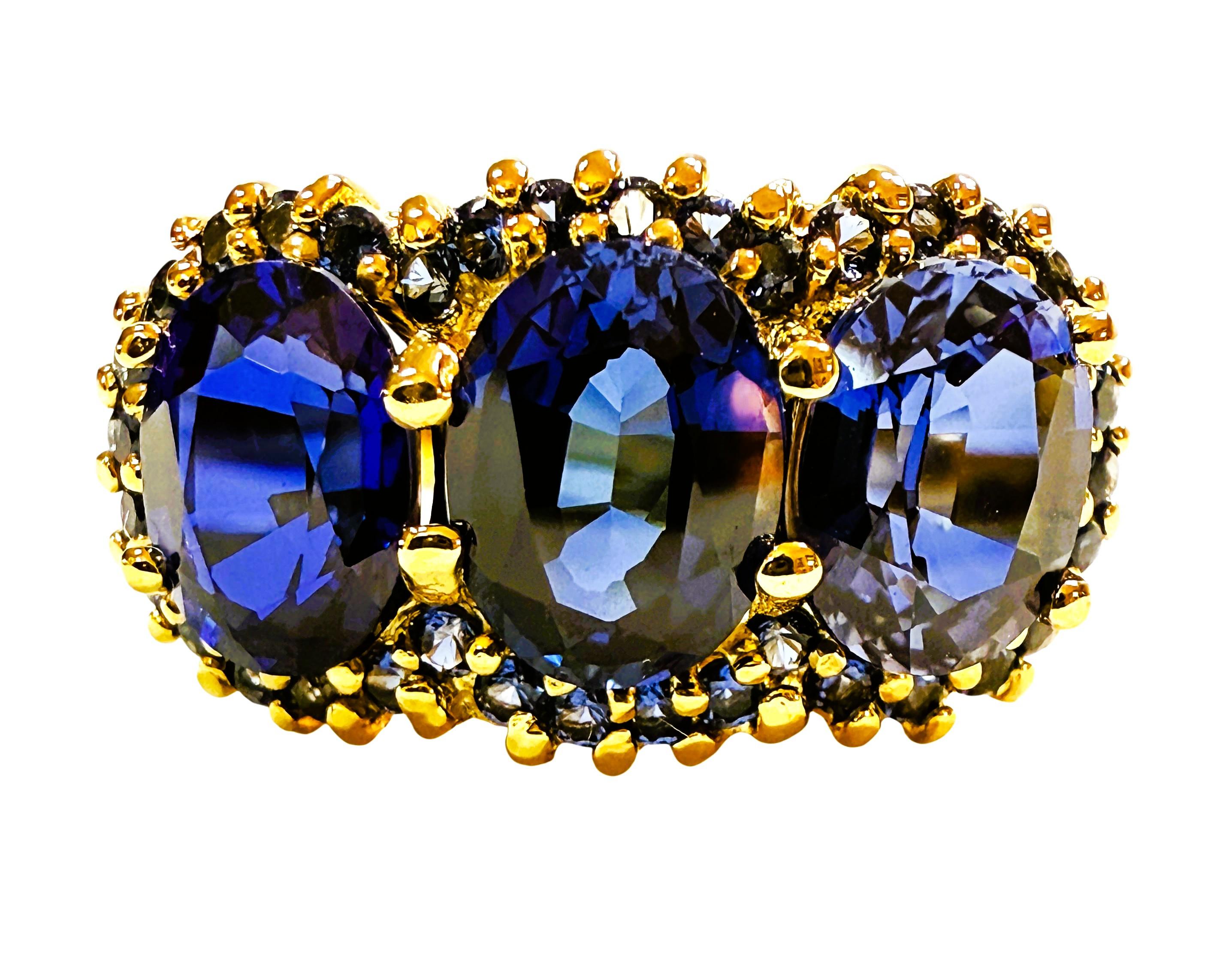 This is such a beautiful ring.  These stones are from Sri Lanka and just a beautiful shade of blue.  The ring is a size 7.75.  They are fancy cut oval stones and 8.3 x 6.5 mm.  They are surrounded by diamond cut blue sapphire stones.  They are all