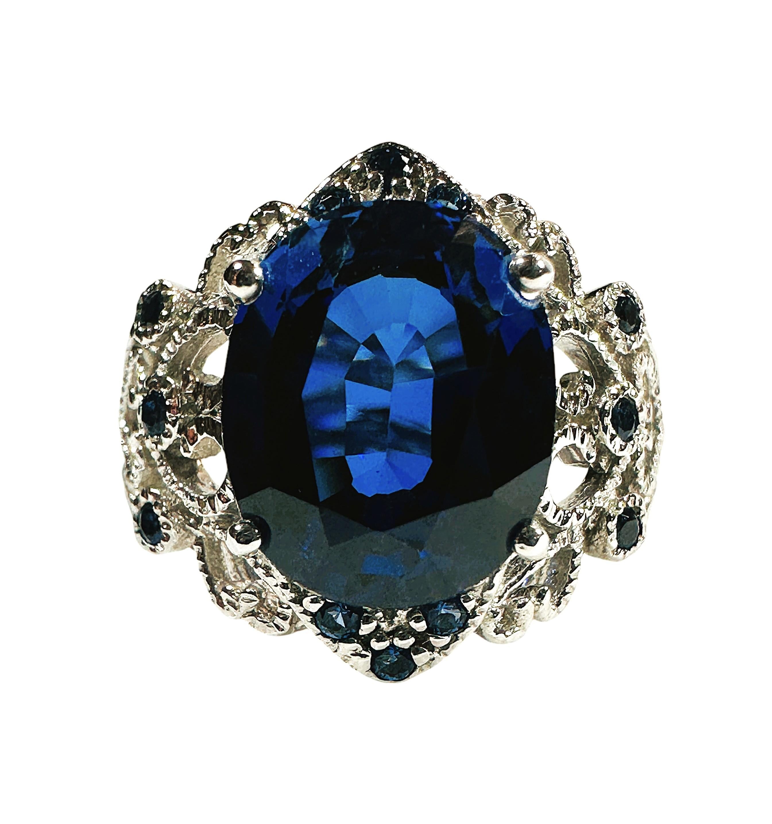 The stone is from Sri Lanka and is just exquisite. The stone is a Blue Sapphire and is 6.95 cts. It is a fancy oval cut stone and measures 12 x 9.7 mm and is surrounded by a beautiful Filigree design which is sprinkled Diamond cut Blue Sapphires. 