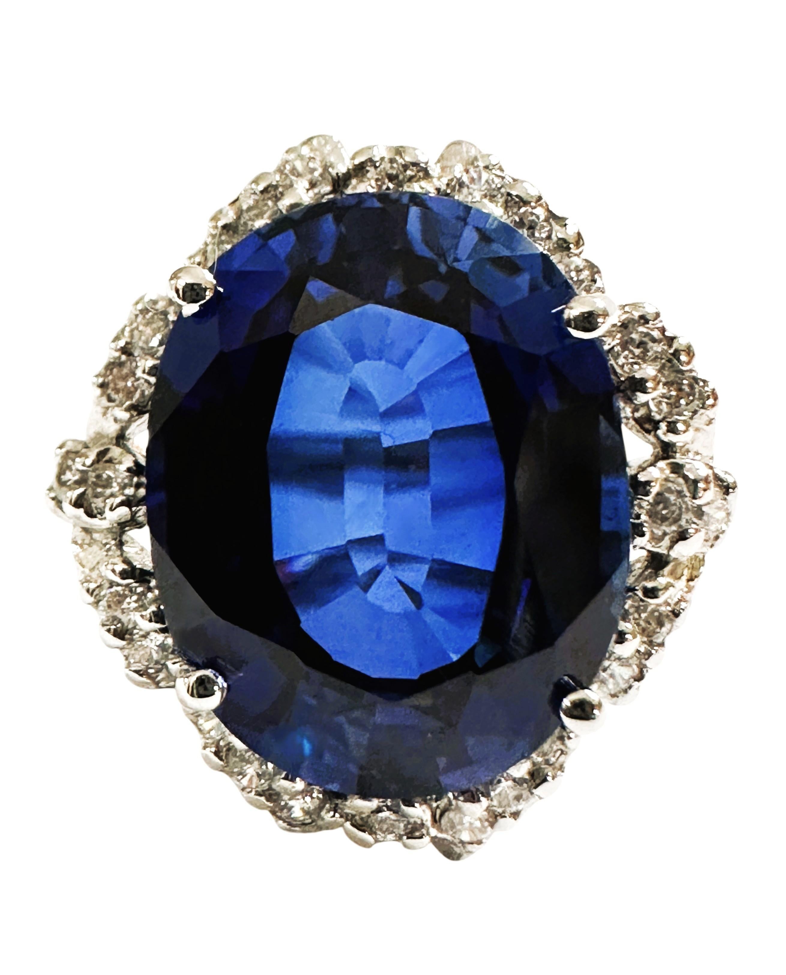The ring is a size 6.75. The stone is from Sri Lanka. It is a beautiful oval cut stone and is 7.78 cts.  It is a very high quality stone.  It measures 14 x 10.8 mm and is surrounded by diamond cut white sapphires.  They are all set in a gorgeous