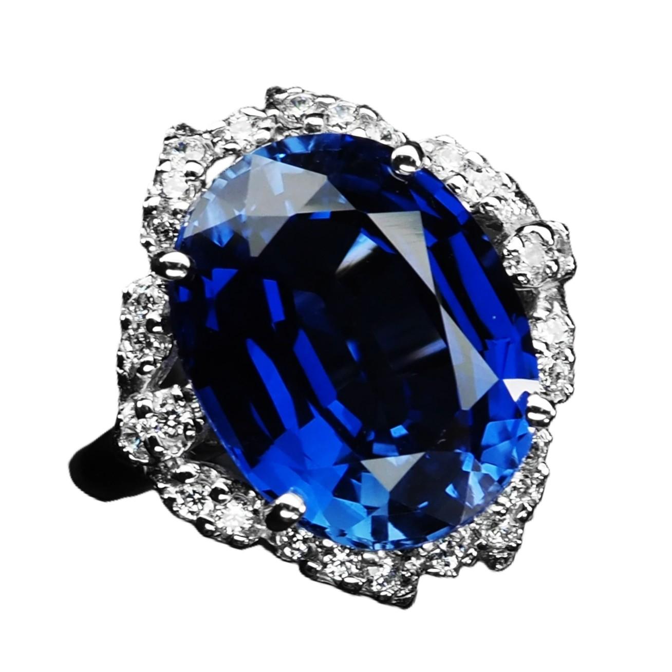 The ring is a size 6.75. The stone is from Sri Lanka. It is a beautiful oval cut stone and is 7.78 cts.  It is a very high quality stone.  It measures 14 x 10.8 mm and is surrounded by diamond cut blue and white sapphires.  They are all set in a