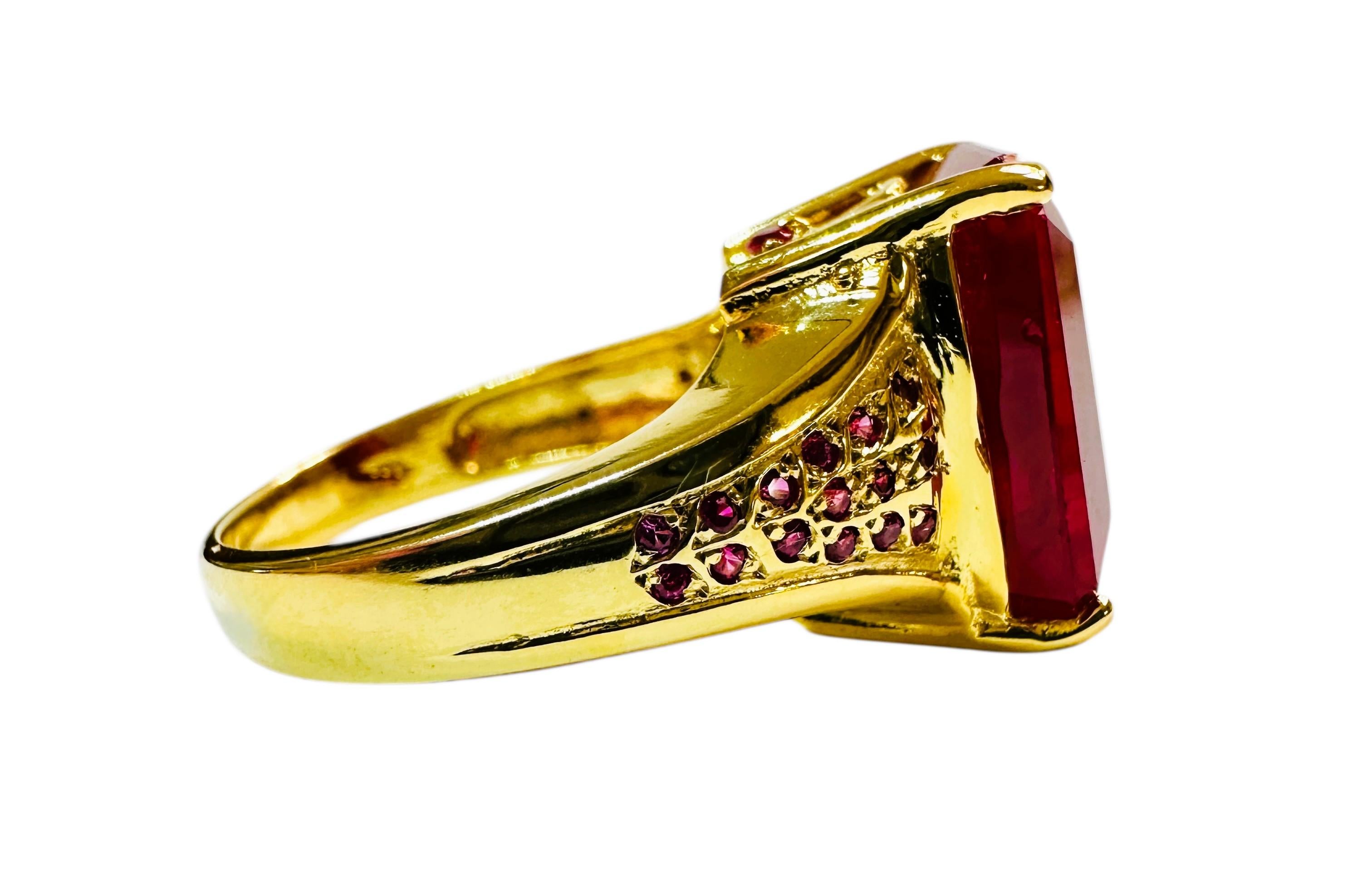What beautiful stone in this ring!  The ring is a size 6.5.  The stone is from Mozambique and is just exquisite.  It is a highly rated stone.  It is a fancy cut baguette stone and is 8.20 Cts   The main stone is 14 mm x 9.5 mm and it is has