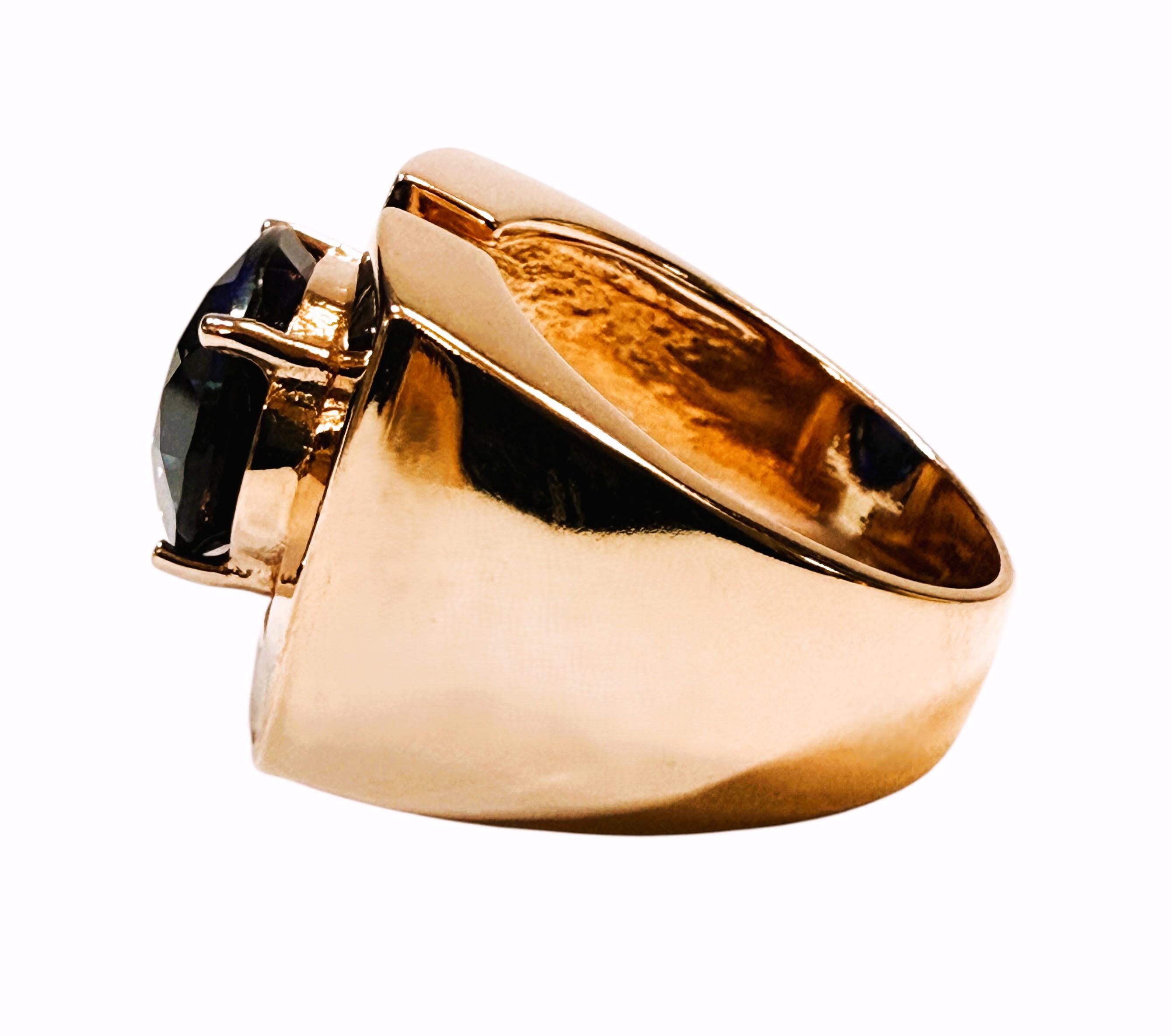 What a beautiful ring! I love the color of the setting and the bold geometric shape of the setting.  The setting is a Rose Gold Plated 925 Sterling Silver bold setting.  The ring is a size 8.25.  It is a beautiful fancy oval cut stone and is 8.70