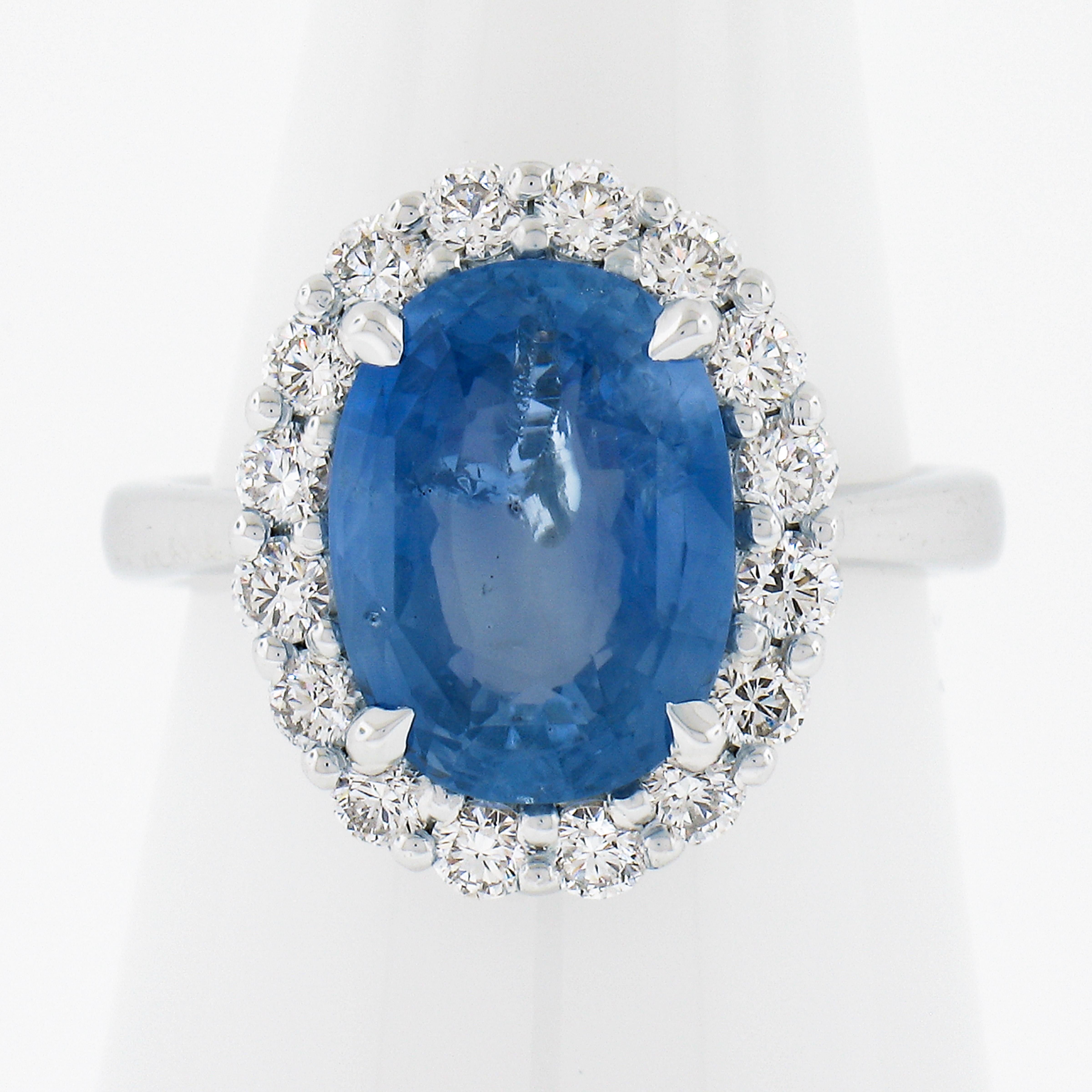 --Stone(s):--
(1) Natural Genuine Sapphire - Oval Brilliant Cut - Claw Prong Set - Blue Color with Natural Inclusions - No Heat -  5.49ct (exact - certified)
** See Certification Details Below for Complete Info **
(16) Natural Genuine Diamonds -