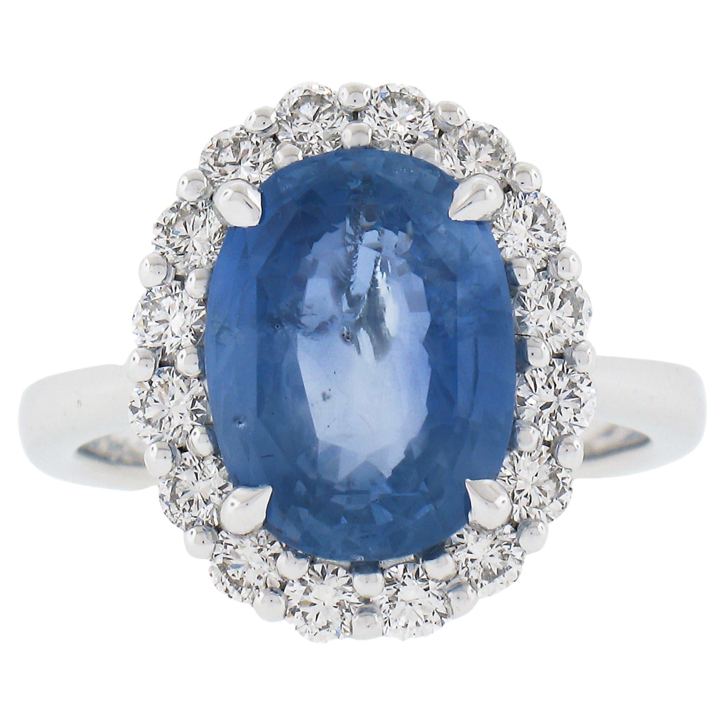 New .900 Platinum 6.28ctw GIA Oval Blue Sapphire & Round Diamond Halo Ring For Sale
