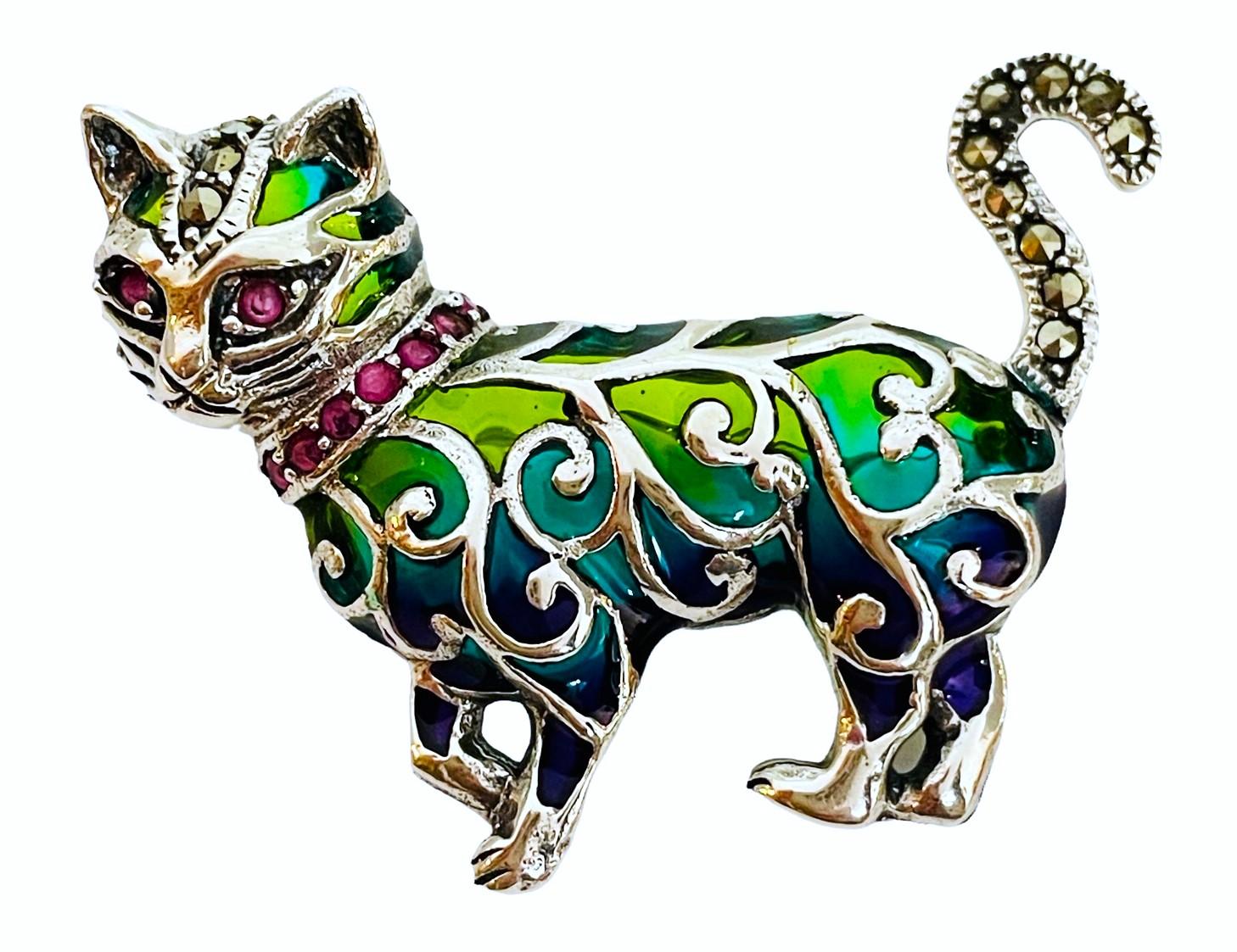 This is a gorgeous little Cat!  Very vibrant and very well made.  Sure to get noticed.  It is 1.75 inches wide and 1.25 inches tall.    The weight in Grams is 9.35  Please take a look at my store.  Many of my items have matching pieces, earrings,