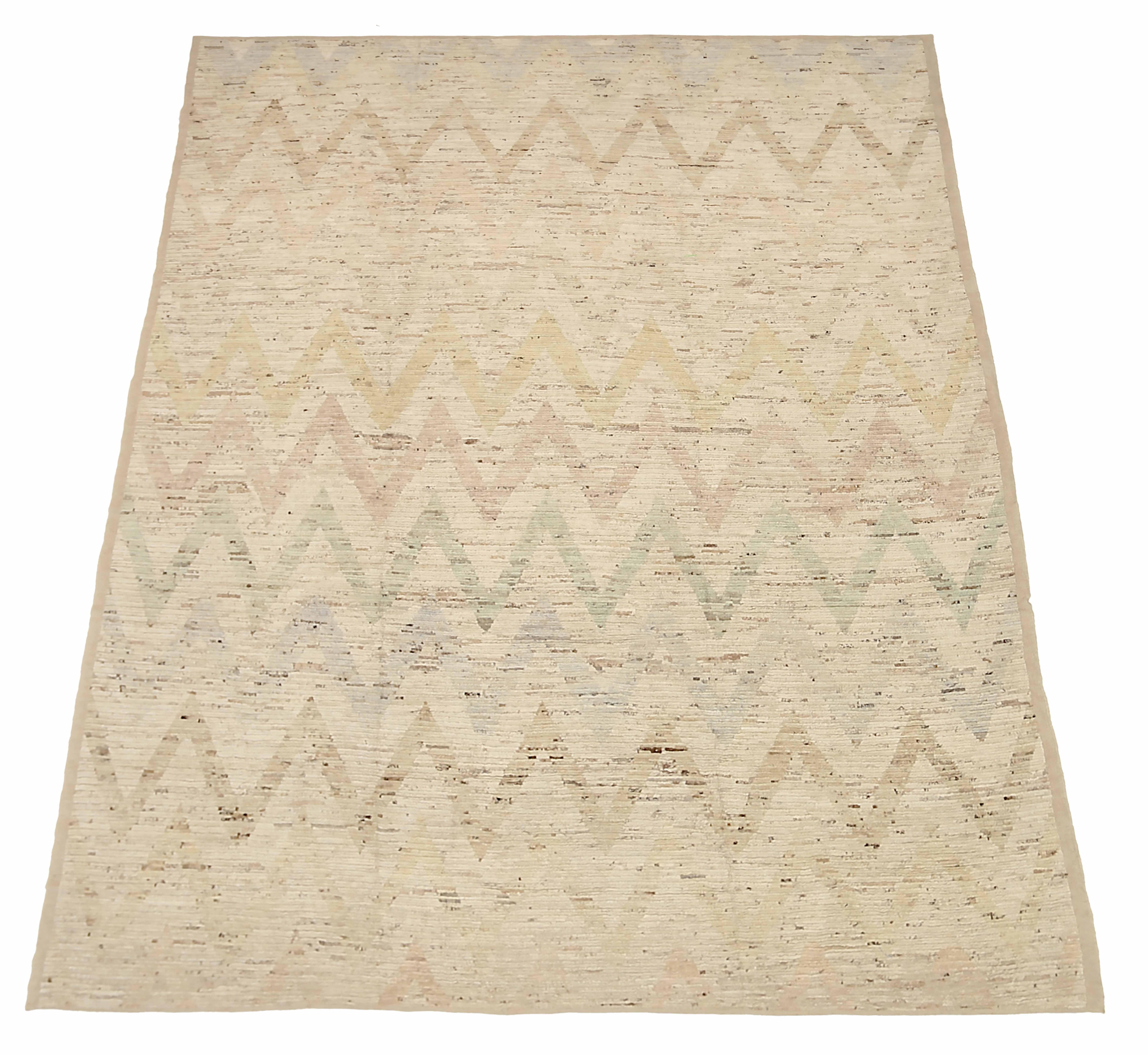 New Afghan area rug handwoven from the finest sheep’s wool. It’s colored with all-natural vegetable dyes that are safe for humans and pets. It’s a traditional Moroccan design handwoven by expert artisans. It’s a lovely area rug that can be