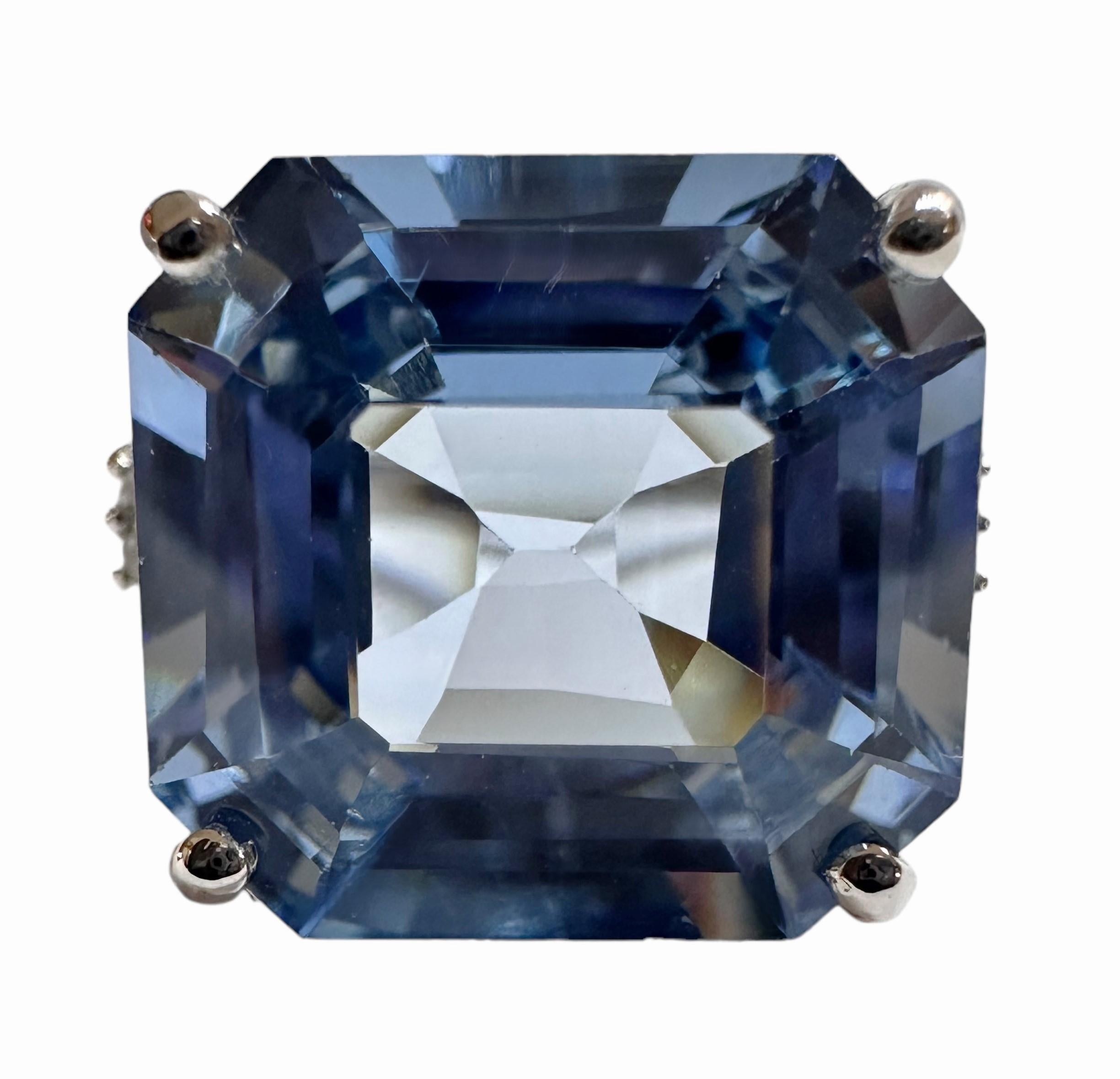 I love the color and cut of this stone. It's such a beautiful shade of blue.  The ring is a size 6.5.  The stone is from Africa and is just exquisite.  It is a fancy asscher cut stone and is 10.0 Cts.   The main stone is 13.2 x 12.5 mm and it has