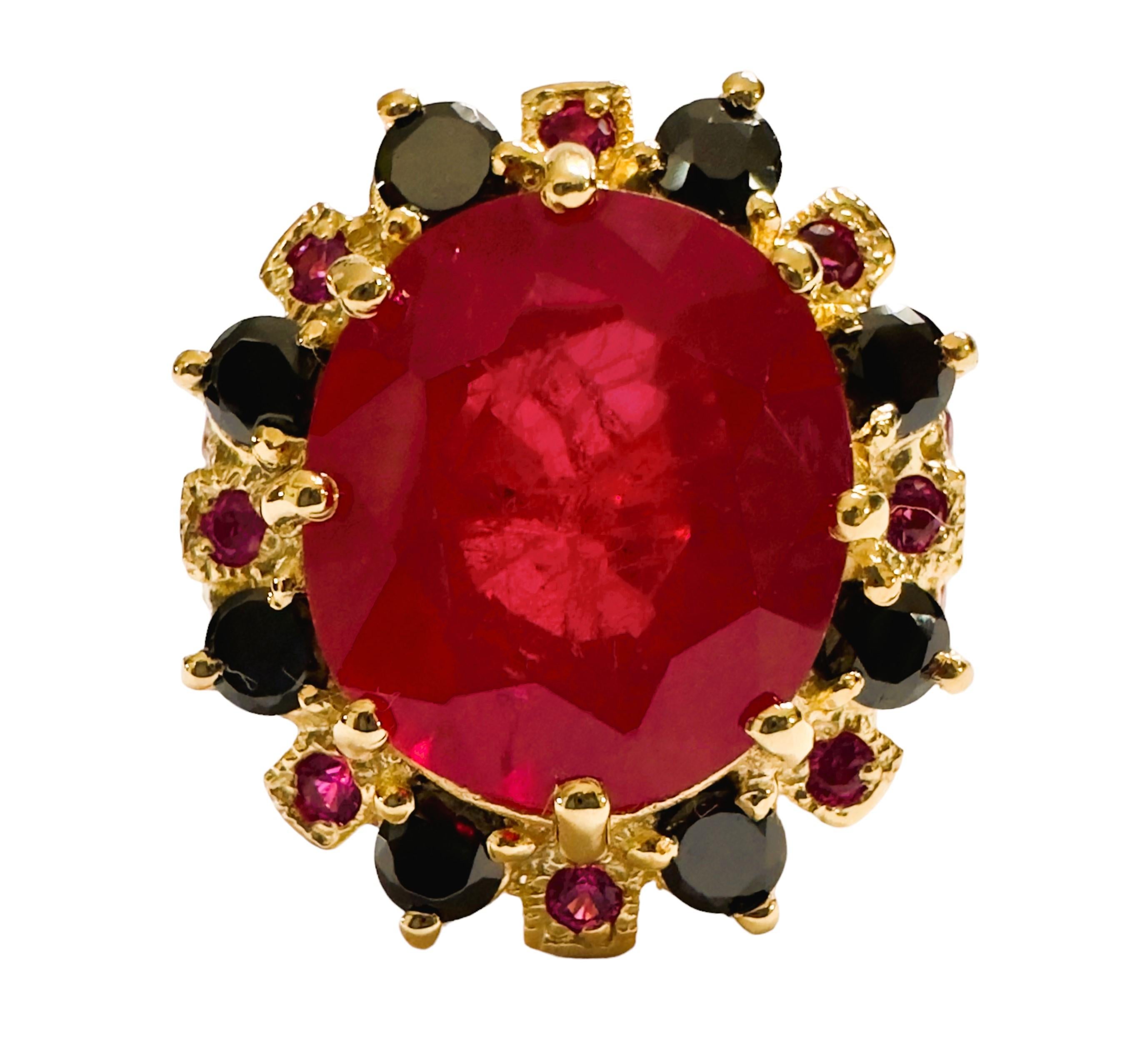 What a beautiful combination of colors in this ring.  The ring is a size 8.  It from Africa and is just exquisite. It is a cushion cut and is 10 Ct   The main stone is 13.5 x 12 mm. It has a beautiful diamond cut Pink Sapphire and Black Spinel