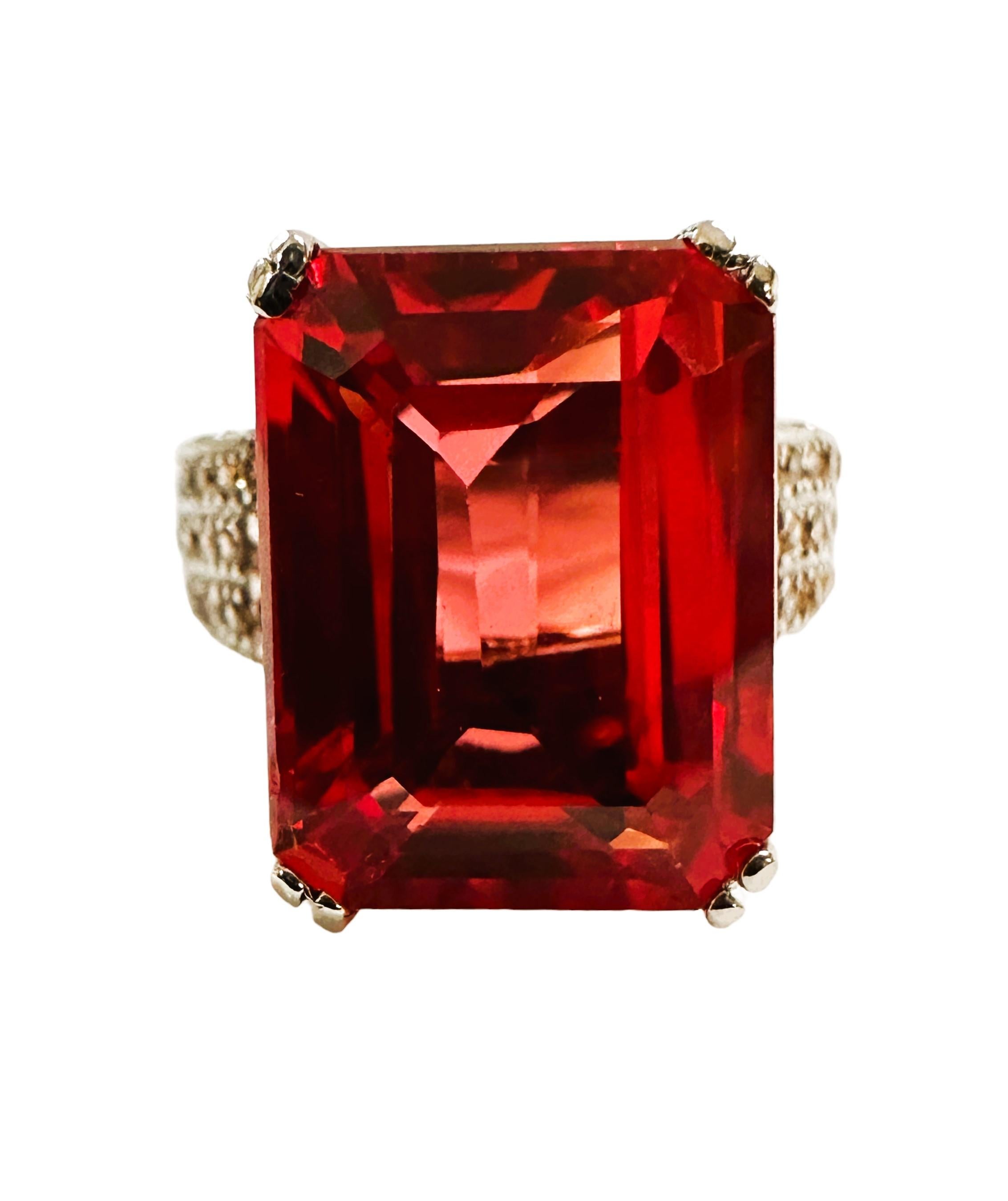 I just love the beautiful colors this ring has!  What a great color combination. The ring is a size 6.   It is from Africa and is just exquisite.   It's a very high quality stone.  It is an emerald cut stone and is 10.7 Cts.   The main stone is 14.2