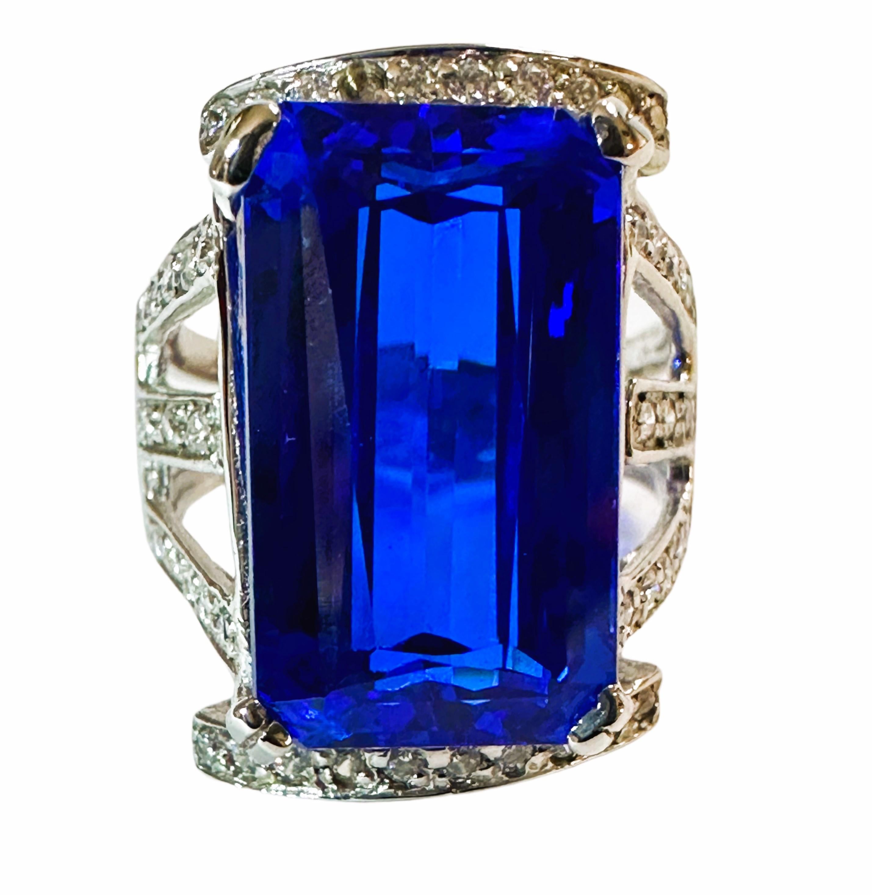 I love the color and cut of this stone. It's such a beautiful shade of blue.  The ring is a size 6.  The stone is from Africa and is just exquisite.  It is a fancy baguette cut stone and is 12.0 Cts.   The main stone is 17.5 x 10.2 mm and it has