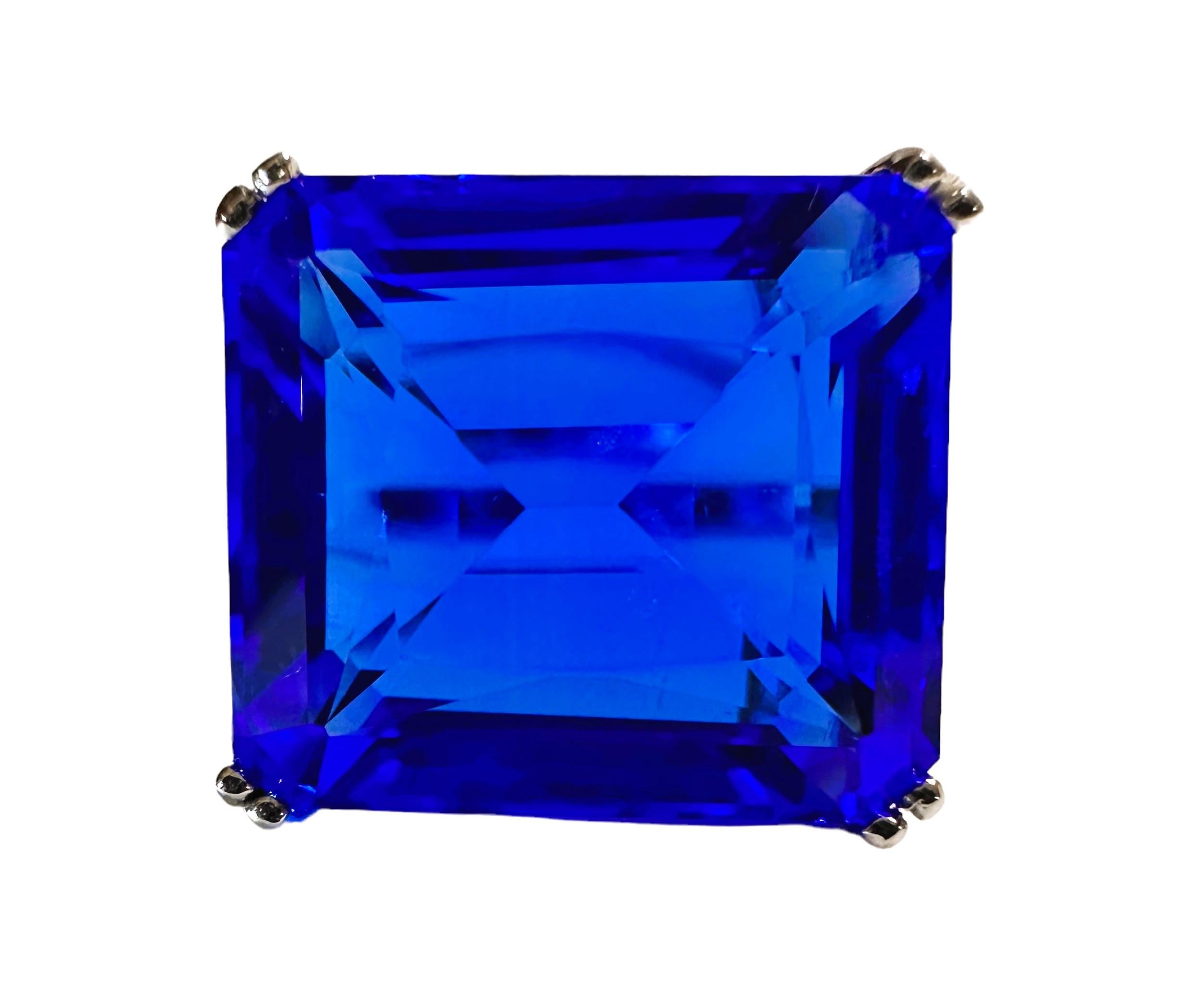 I love the color of this stone.  It is just so brilliant.  The ring is a size 6.75.  The stone is from Africa and is just exquisite.  It is an asscher cut stone and is 12.50 Cts.   The main stone is 14.8 x 12.8 mm and has tiny diamond cut white