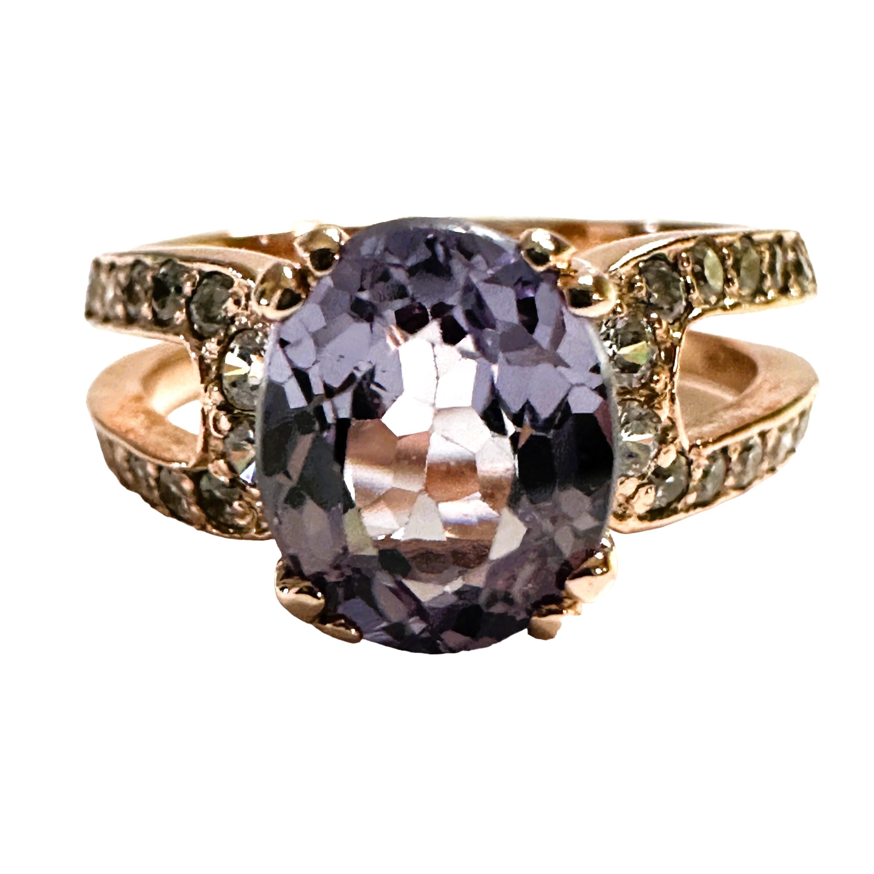 This is just a beautiful gemstone.  The ring is a size 6.5.  It from Africa and is just exquisite.   A very high quality stone. It is a oval cut stone and is 2.10 Cts.   The main stone is 8.7 x 6 mm.   It has a double band that is decorated with