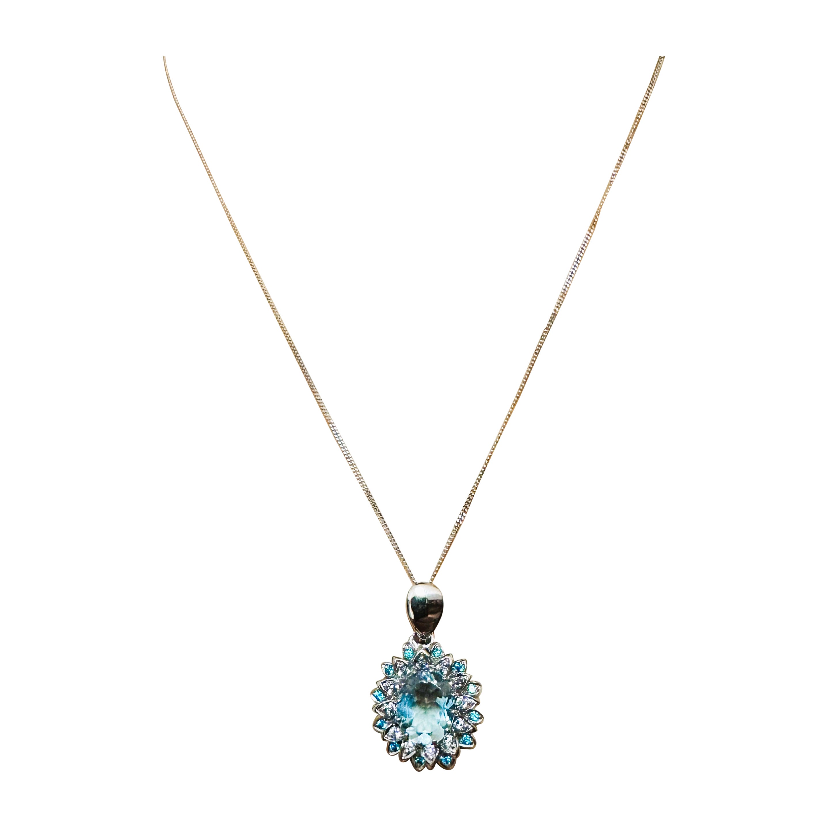 This pendant is just beautiful!  The stones are from Africa and they are just exquisite. It is a very high quality stones. The main stone is 3.5 cts.  It's an oval cut stone and  measures 12 x 10 mm. It is surrounded by diamond cut white sapphires