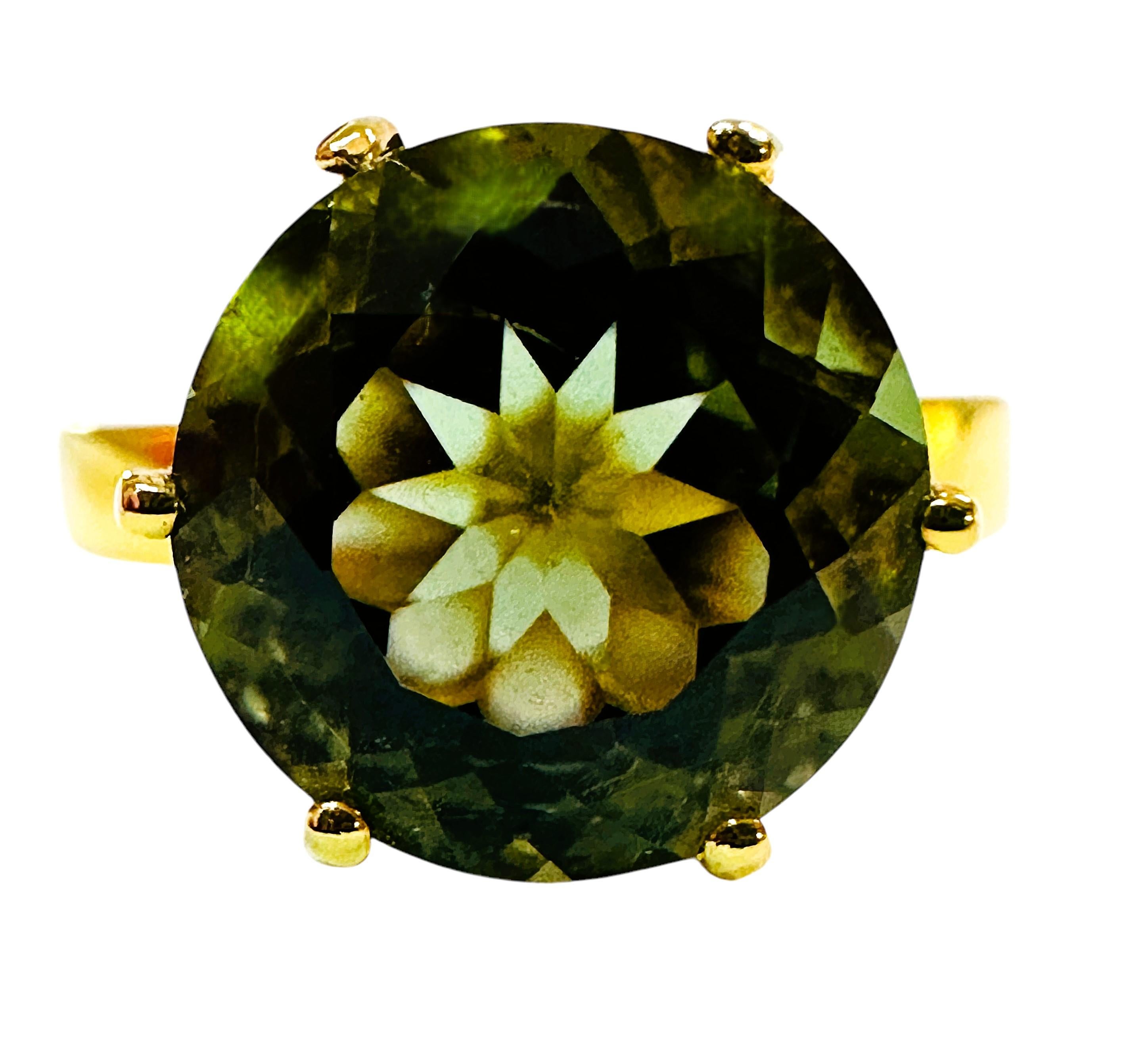 What beautiful stone in this ring!  The ring is a size 6.  The stone is from Africa and is just exquisite.  It is a highly rated stone.  It is a round cut stone and is 3.80 Cts   The main stone is 10 mm round.  It has beautiful diamond cut light